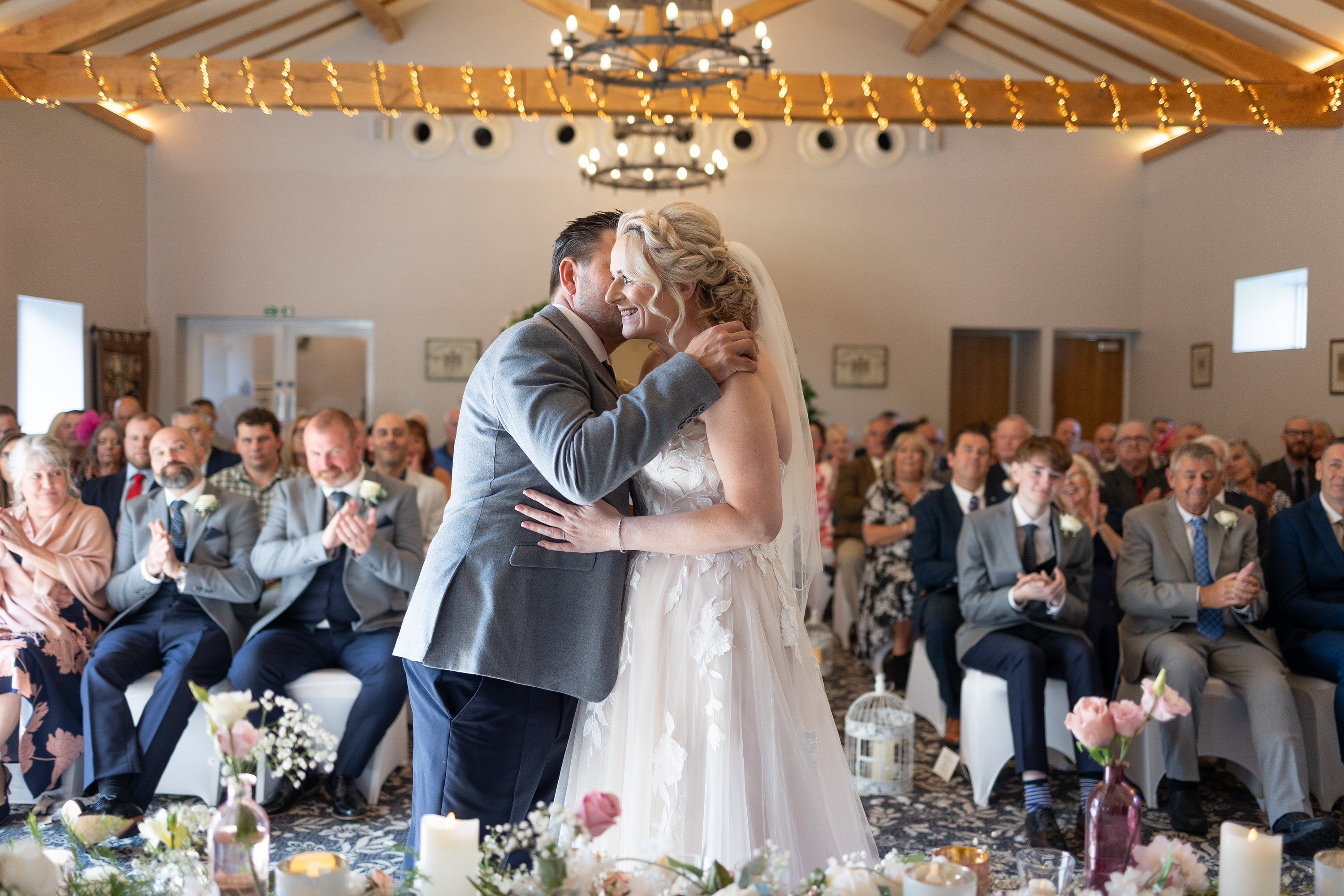 The groom whispers to his wife 