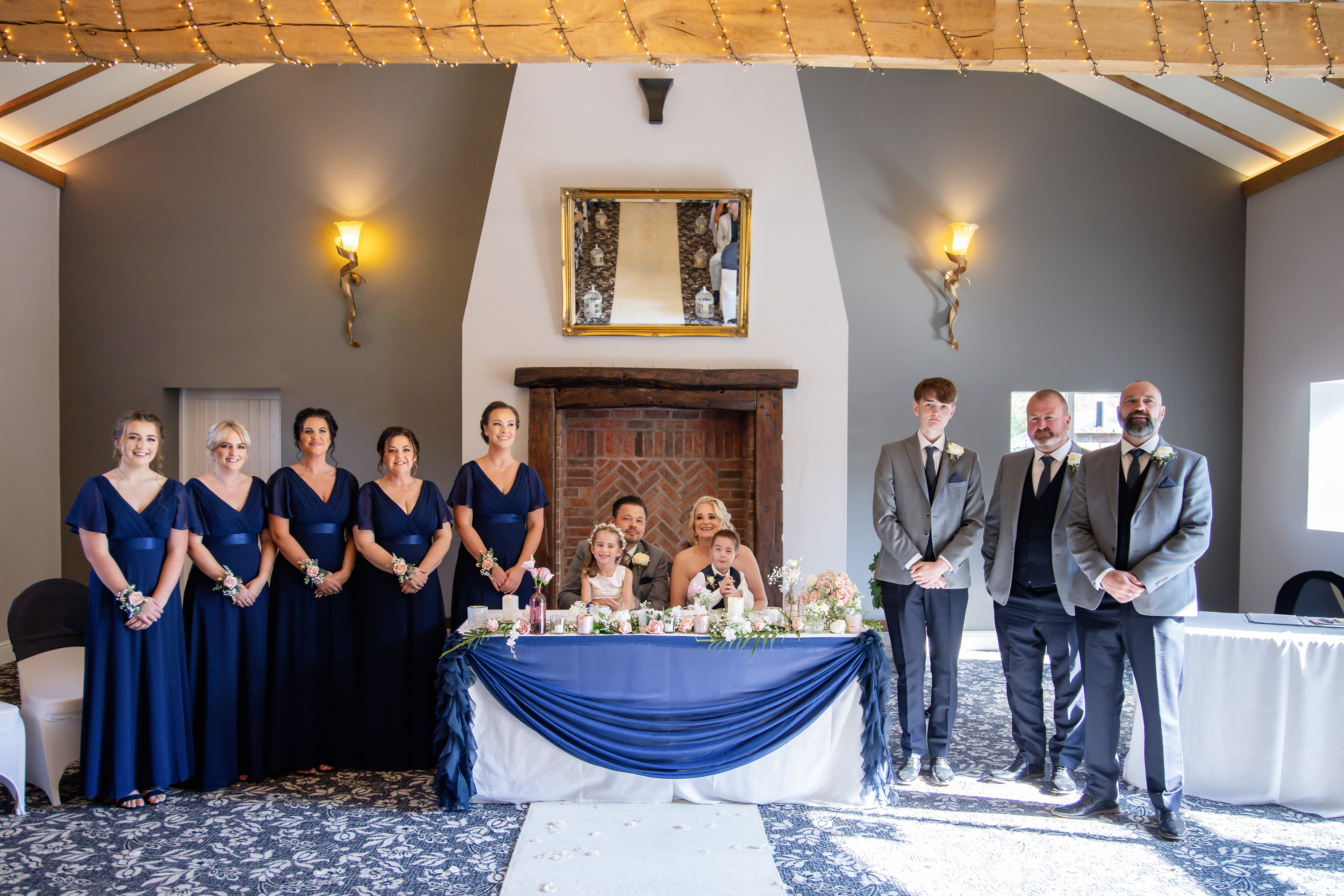 A group photo of the bridesmaids and groomsmen 