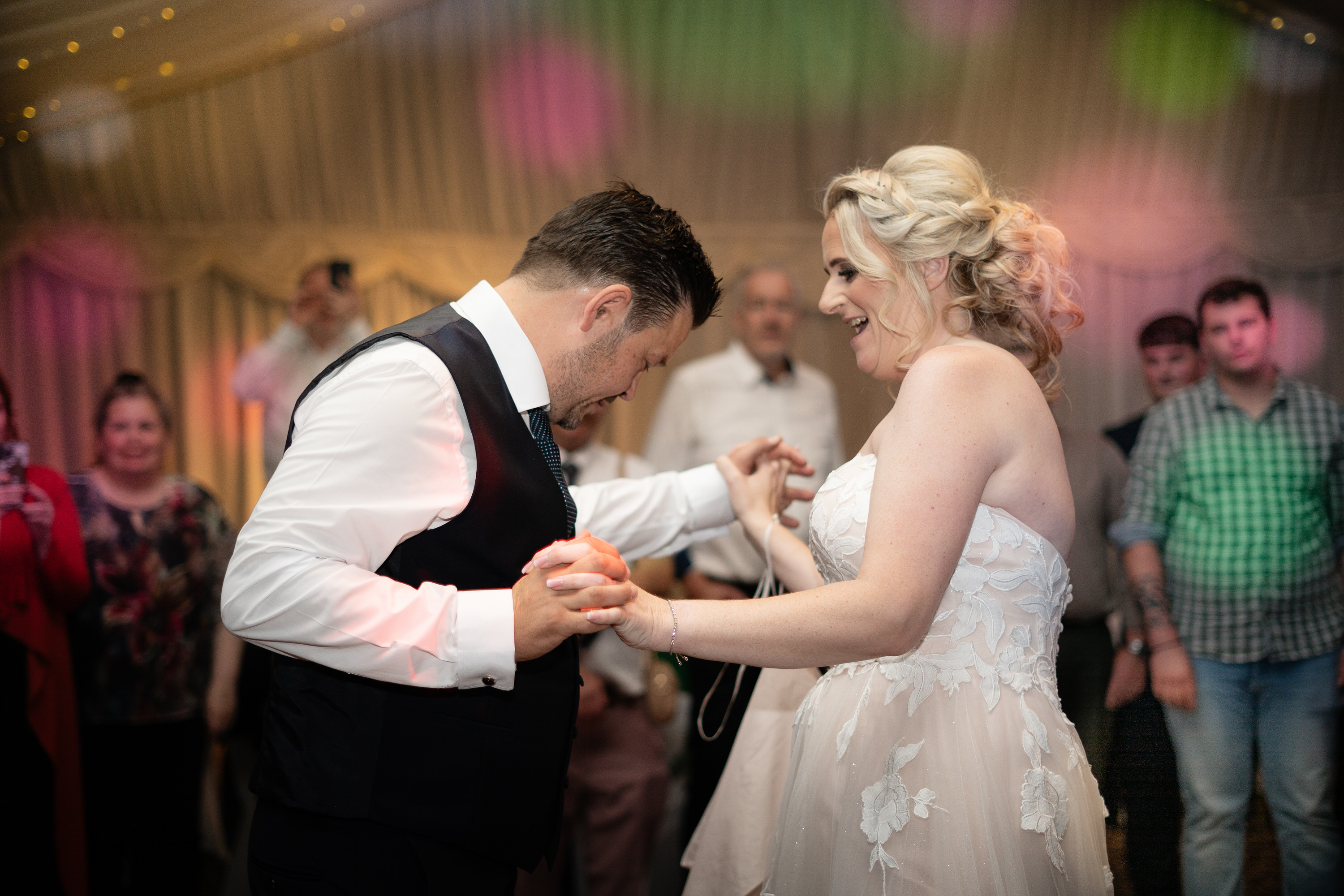 The bride and groom have their first dance