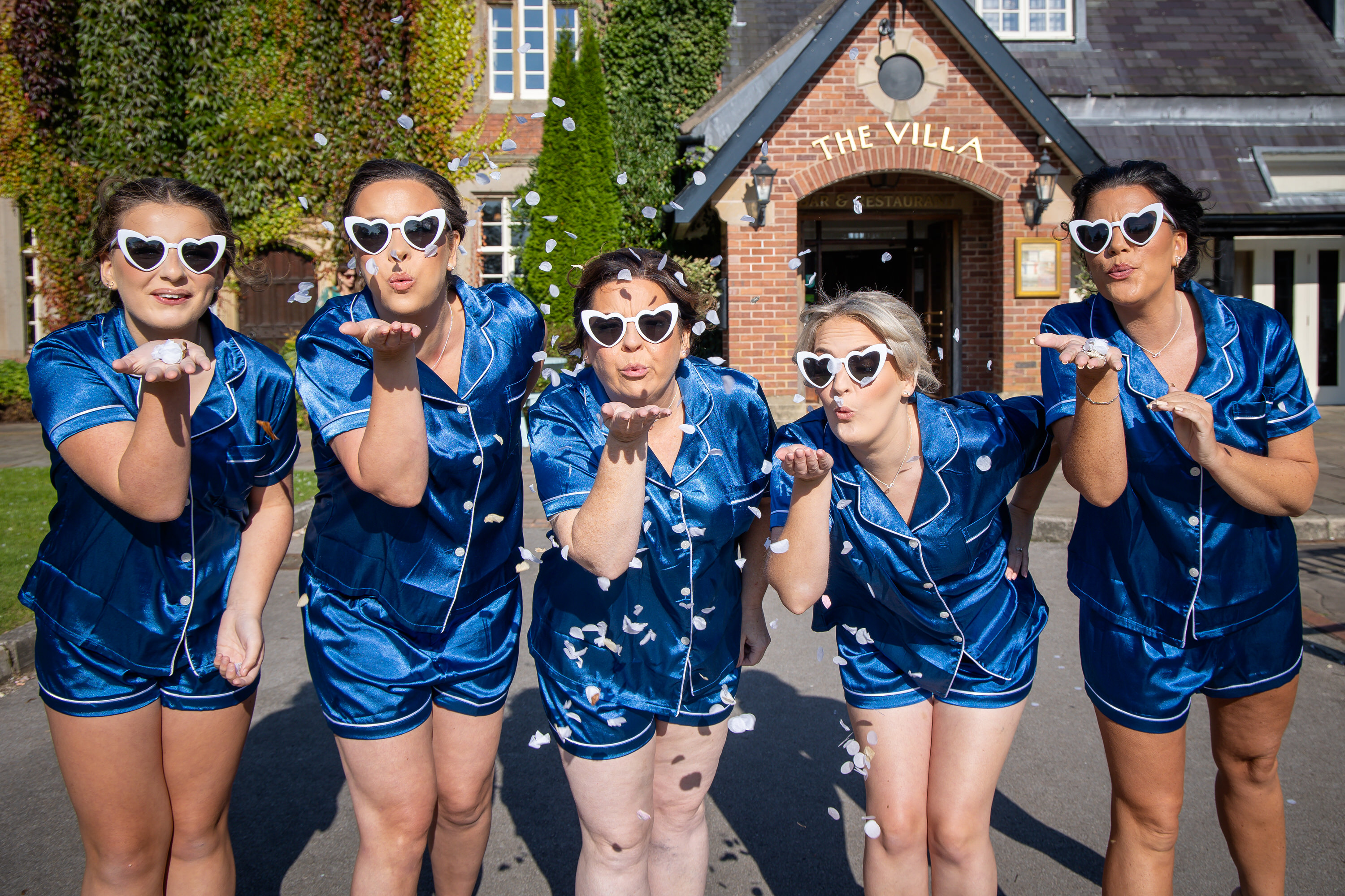 The bridesmaids having fun outside 