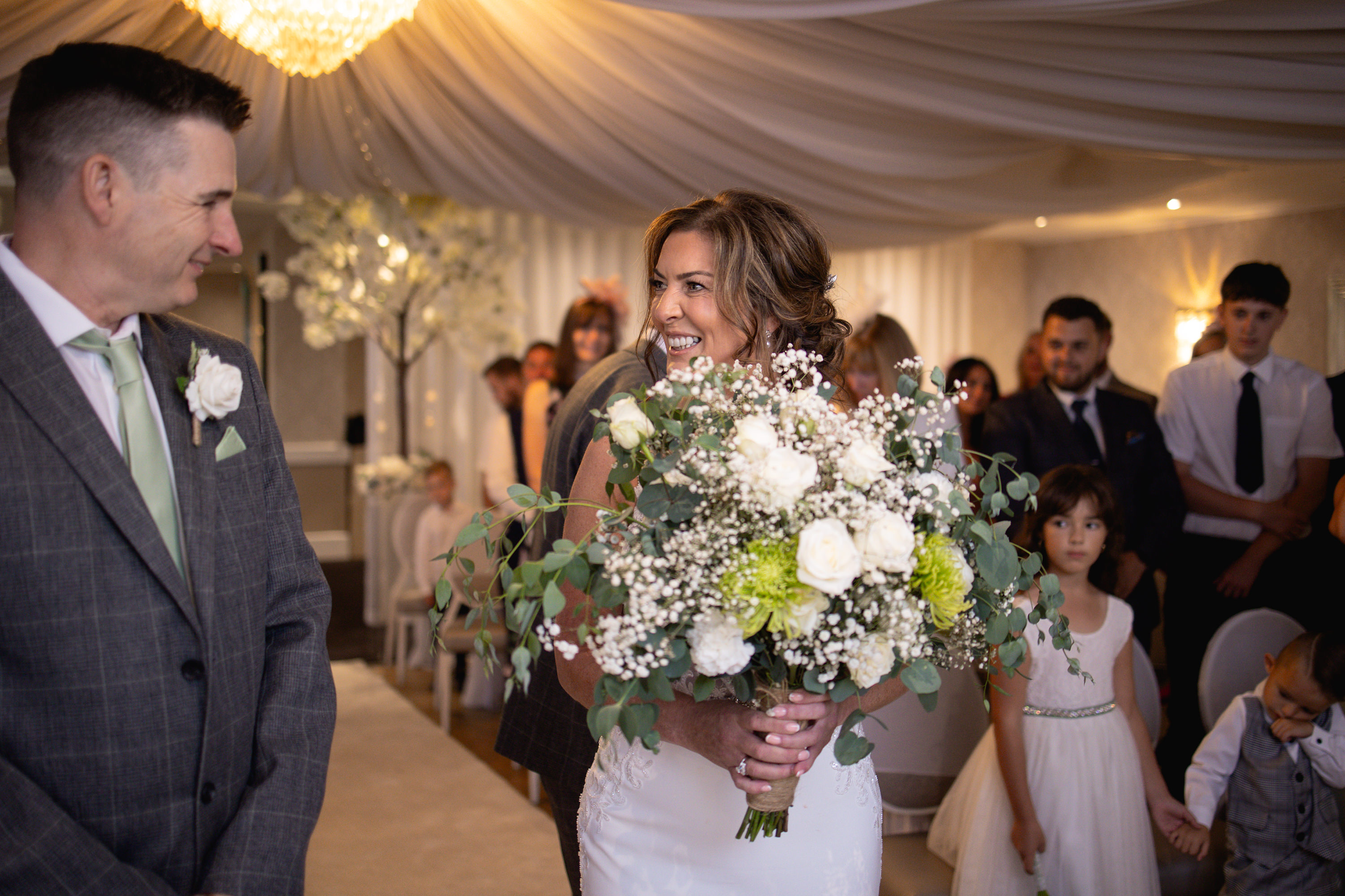 Claire walks down the aisle in the Georgian suite at the Glendower hotel