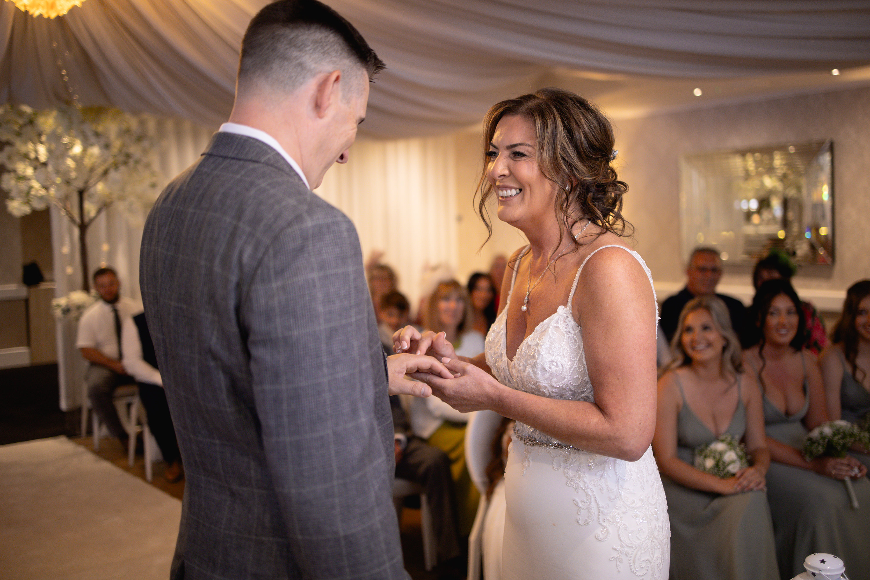 The bride and group exchange their wedding rings 
