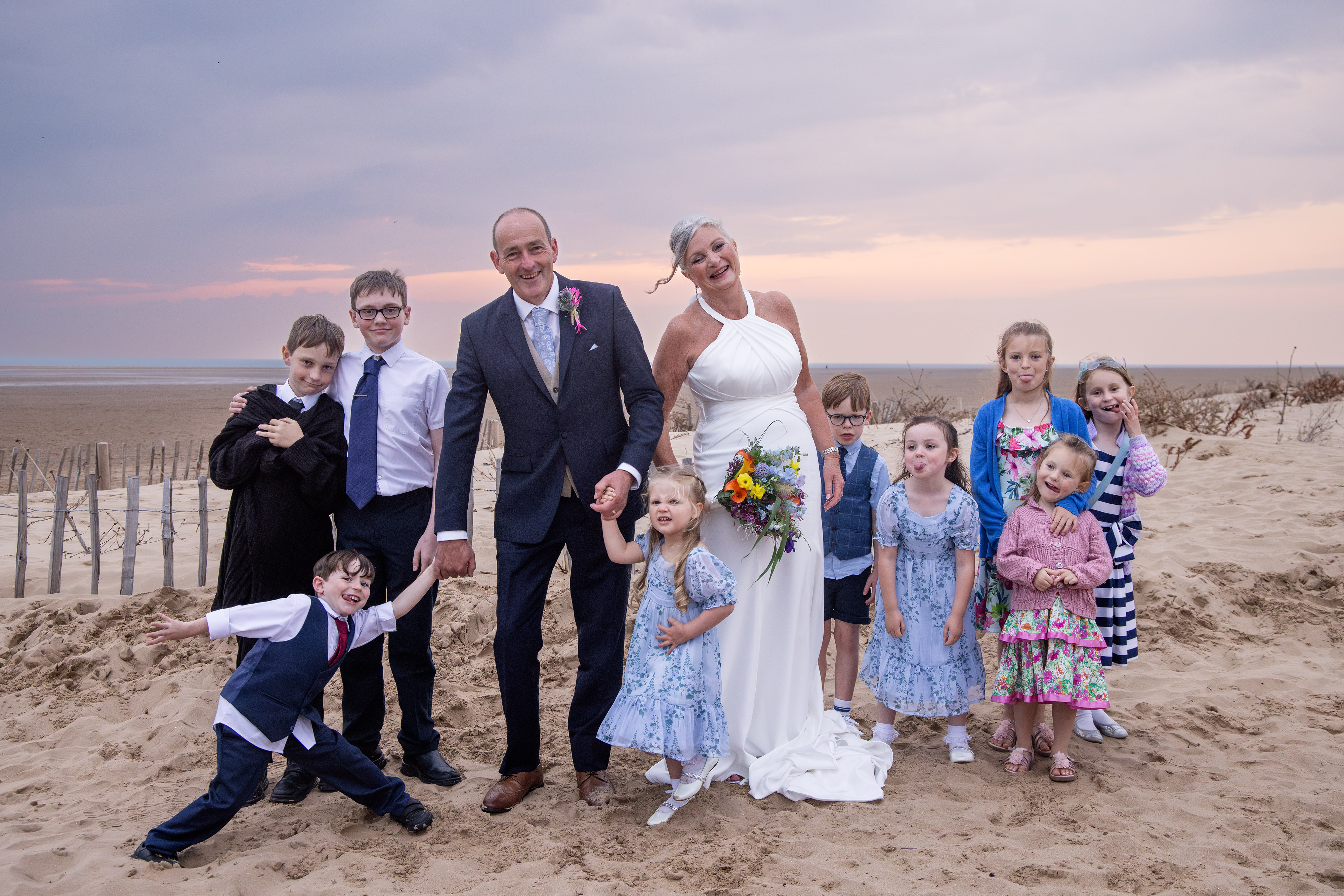 The bride and groom with the guests children 