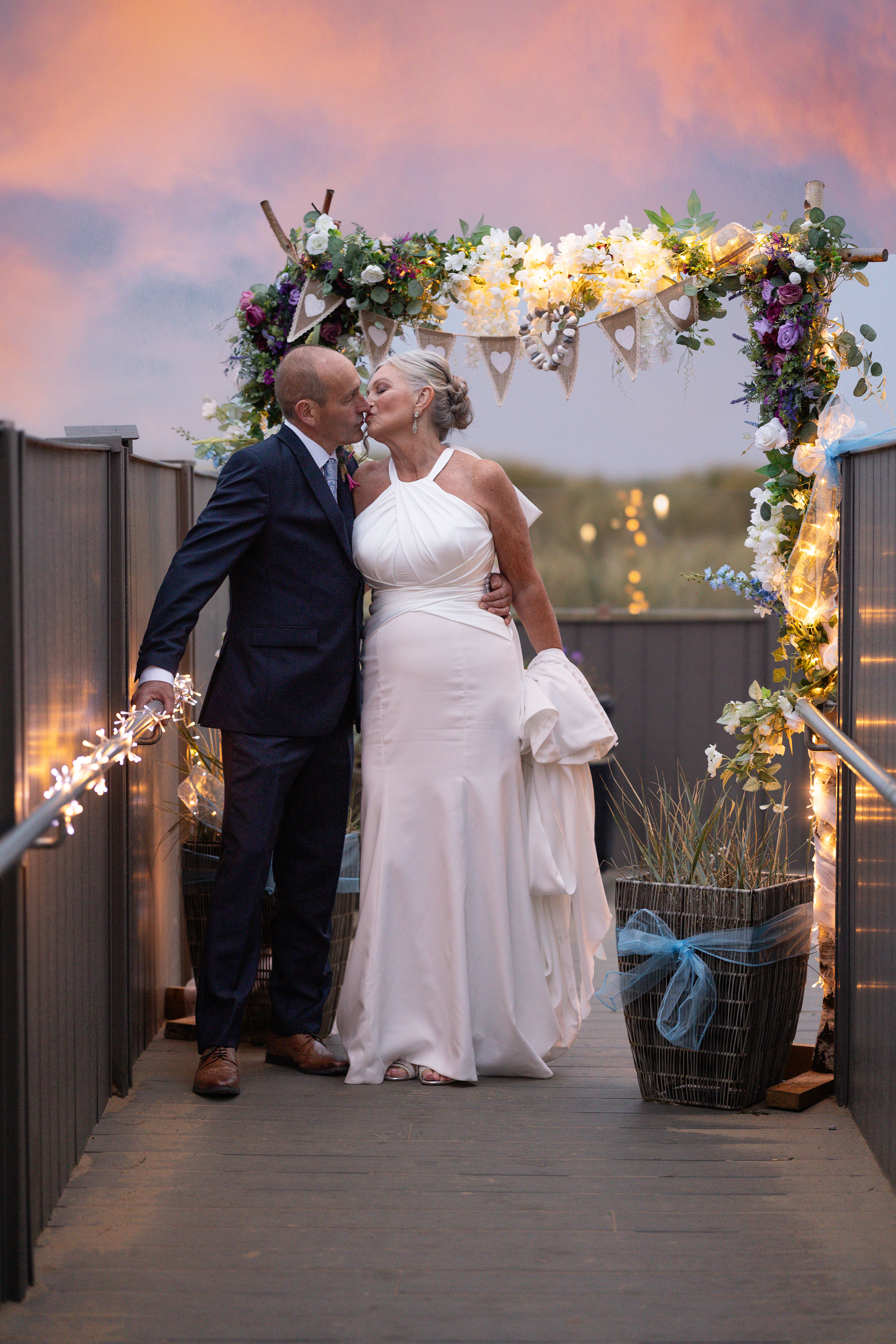 The bride and groom have a kiss 