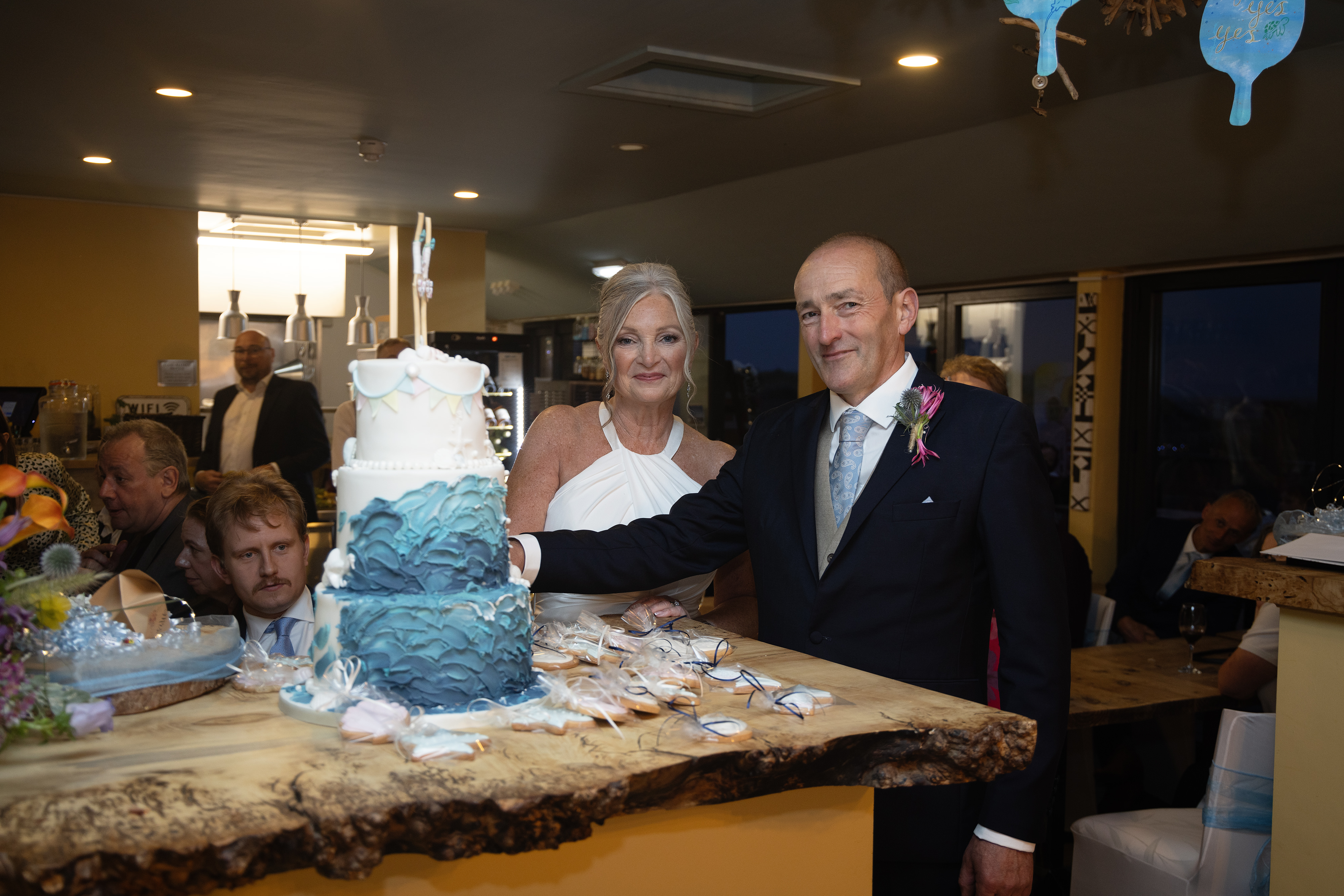 The bride and groom cut their wedding cake 