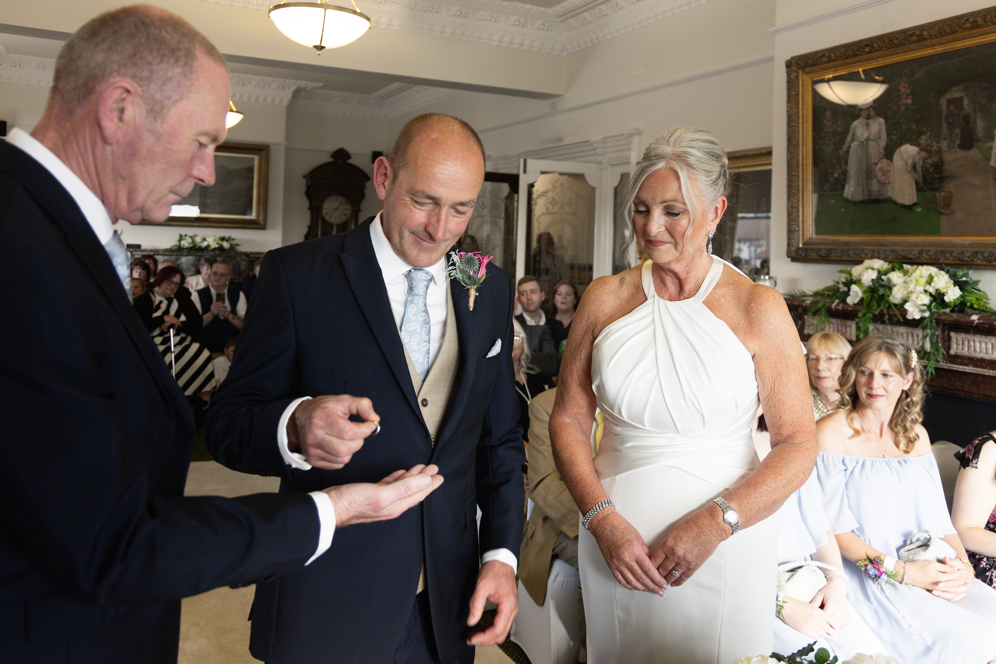 The best man hands over the wedding ring 