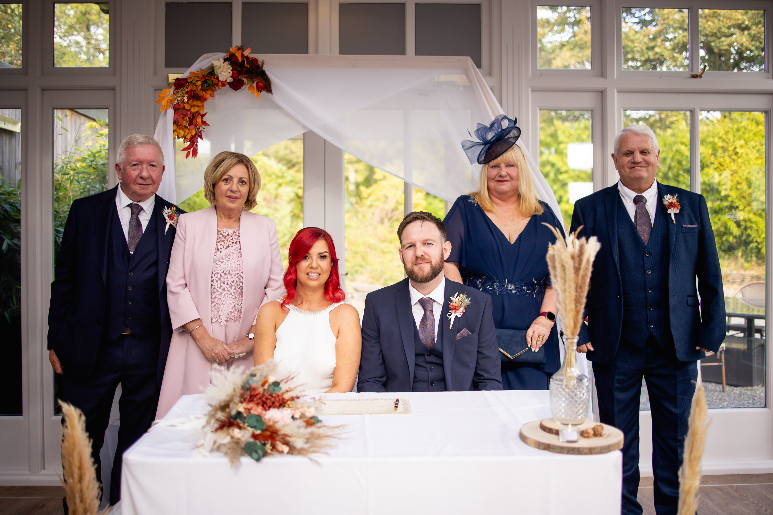 The bride and groom with their parents 
