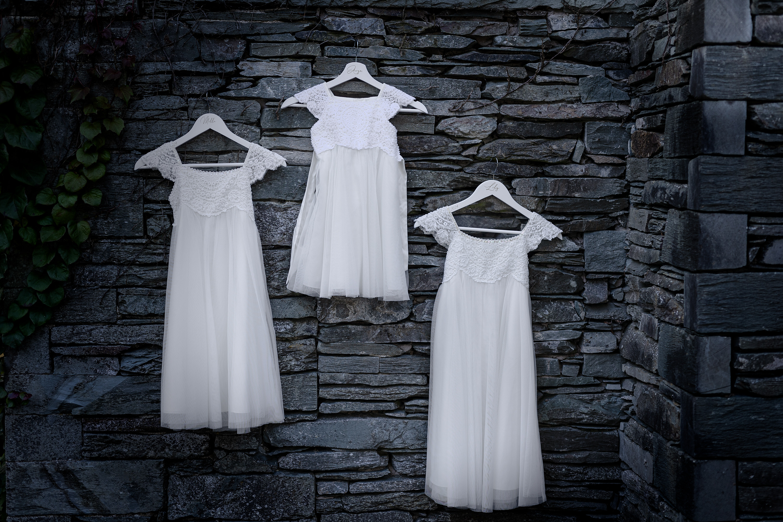 The bridesmaids dresses hanging up 