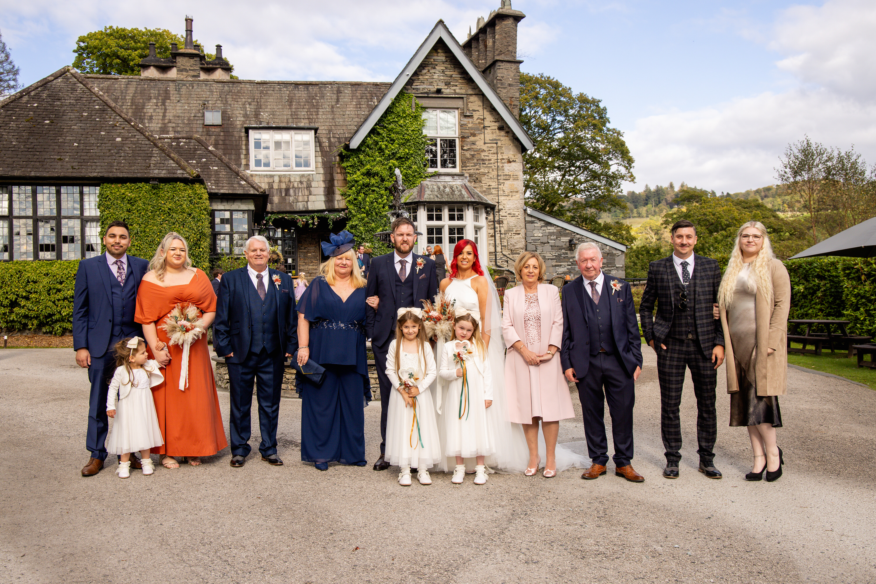 The bride and groom with their family 