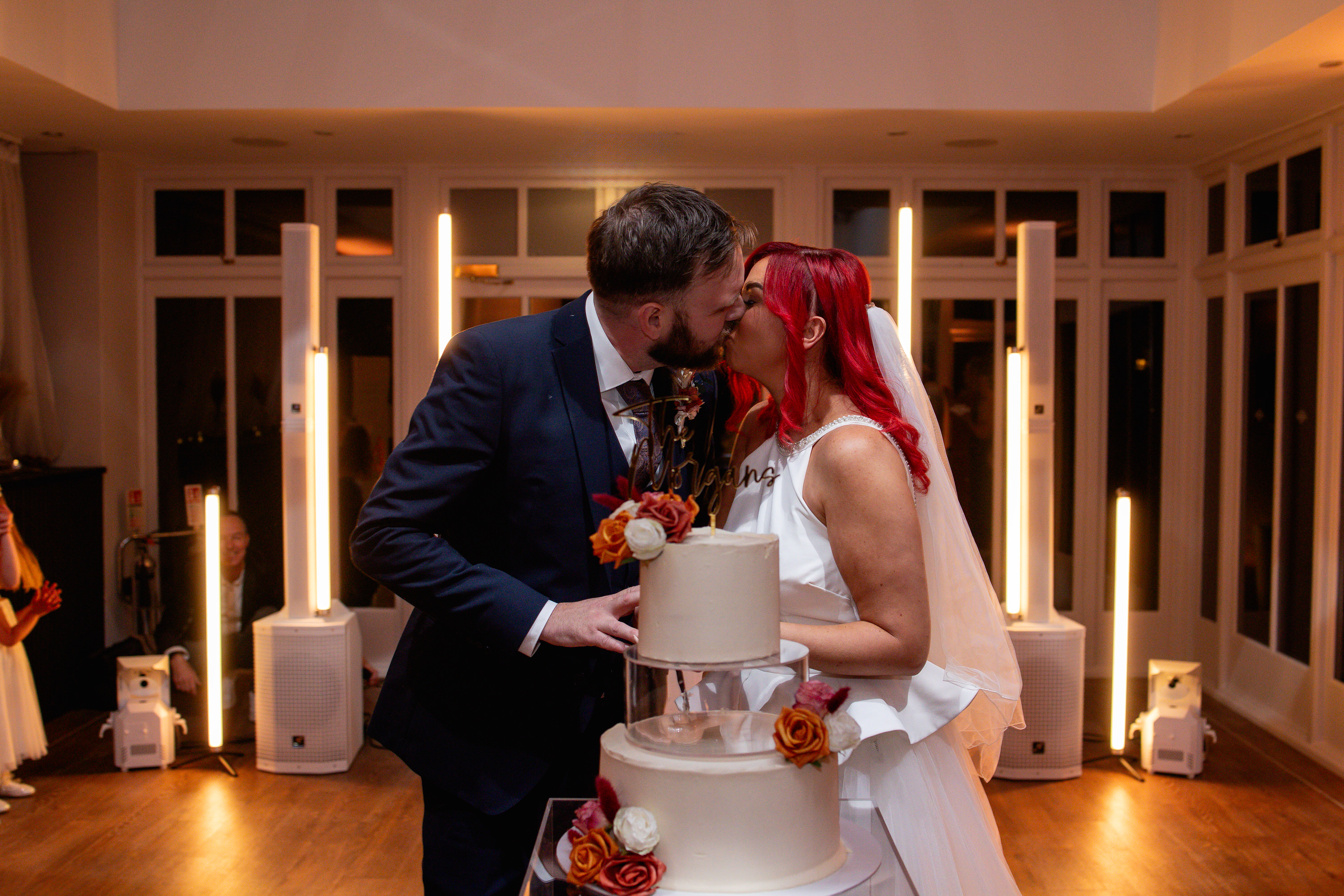 The bride and groom cut the cake 