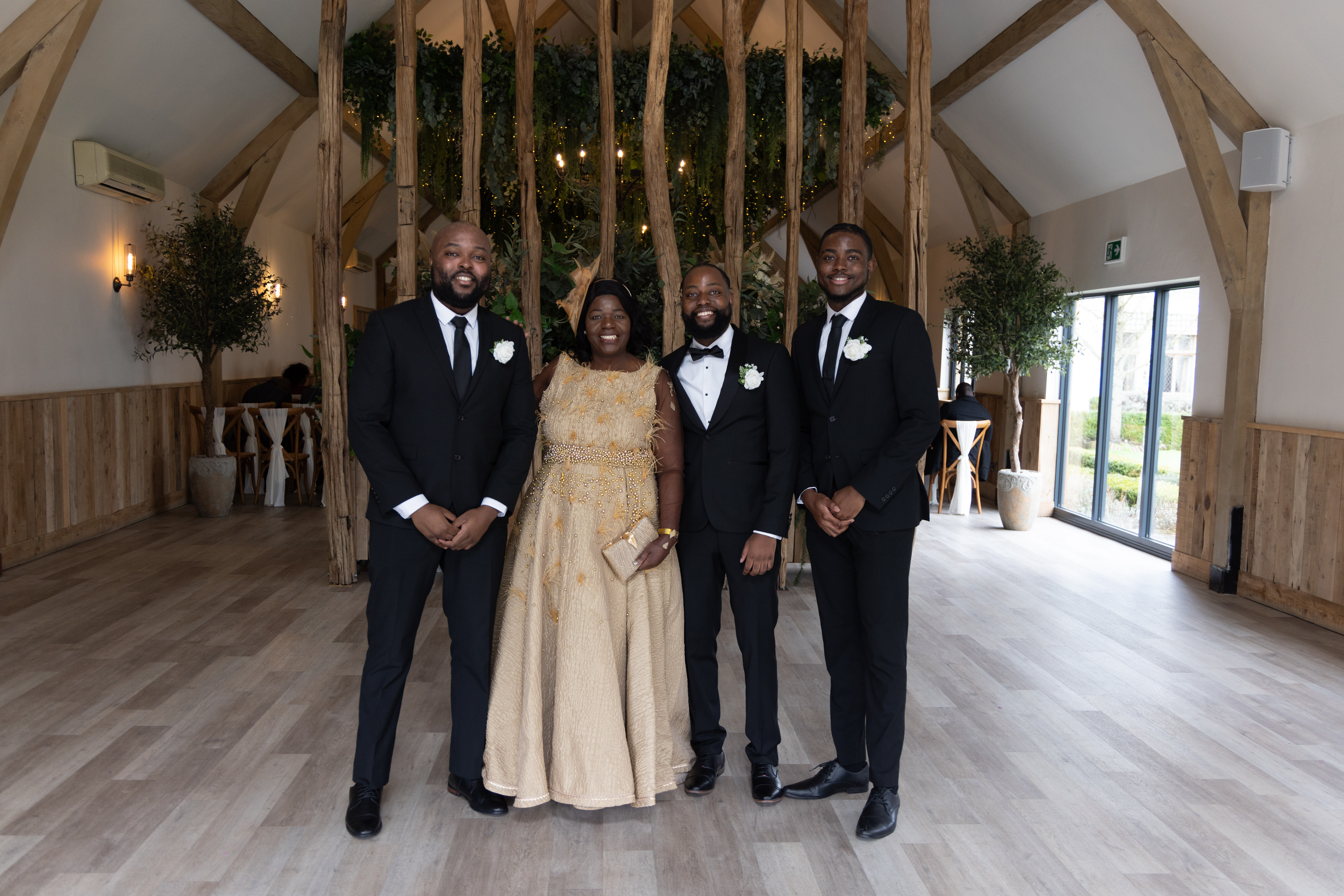 The groom with his mother and best man 