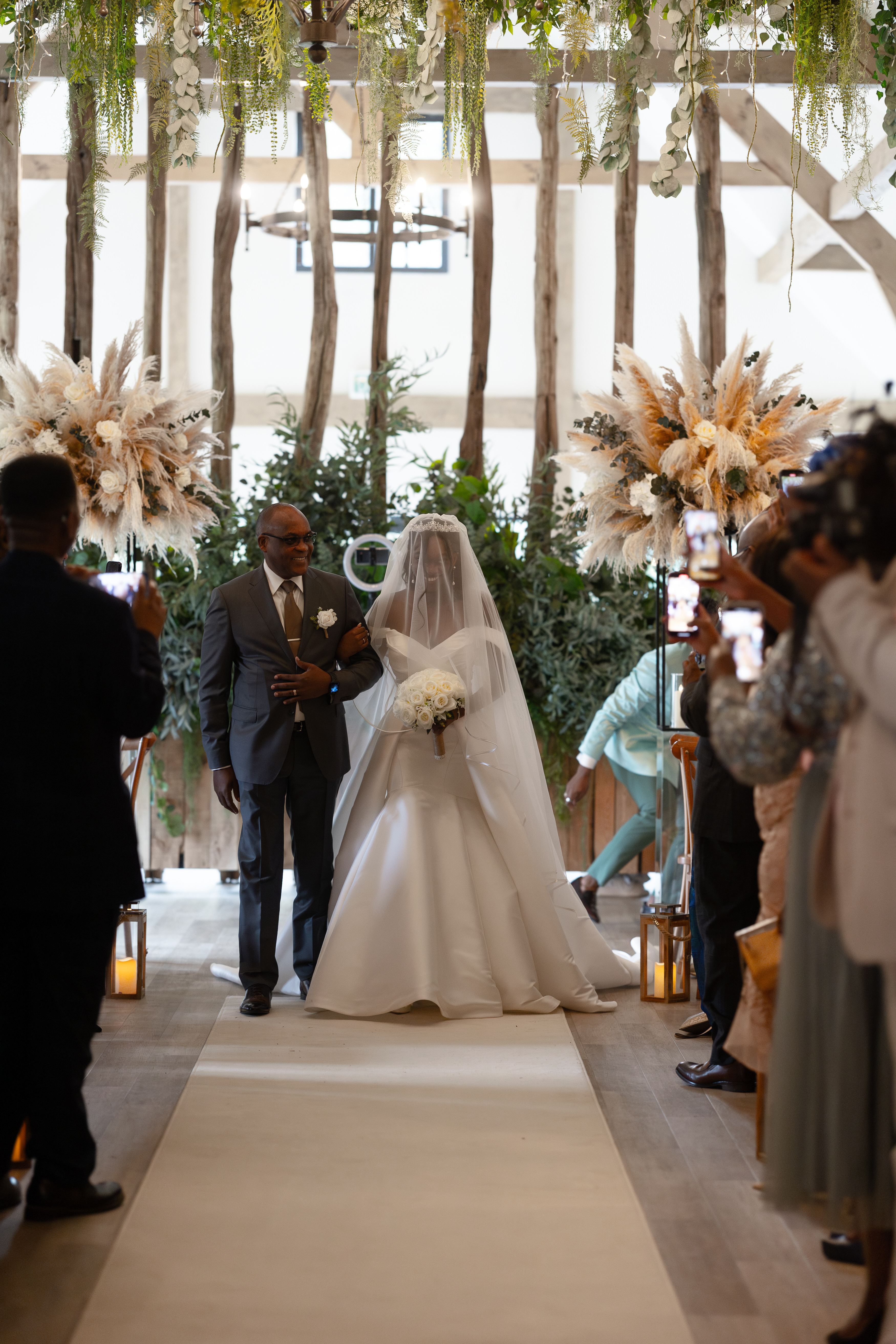 The Brides father walks her down the aisle 