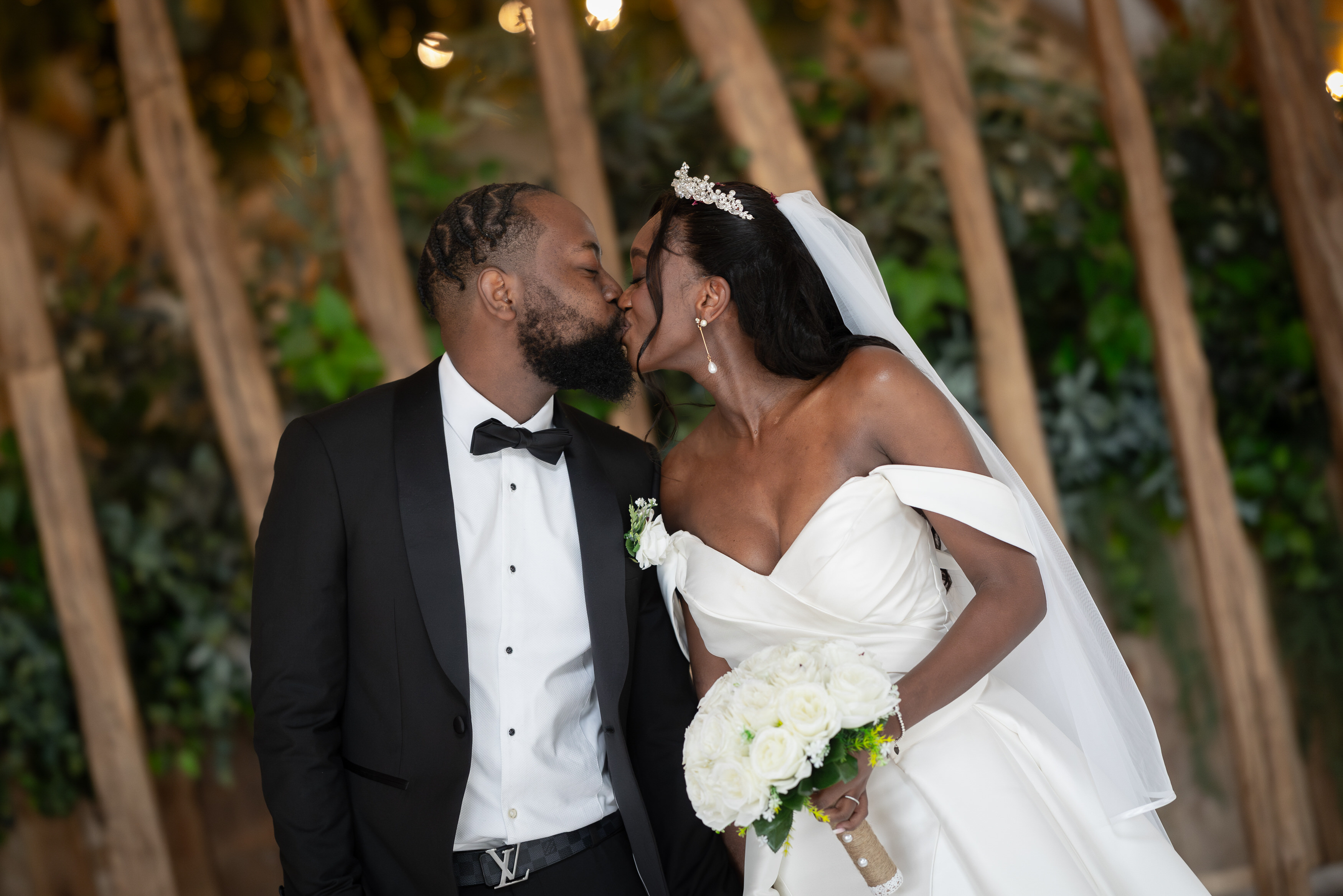 The bride and groom have a kiss