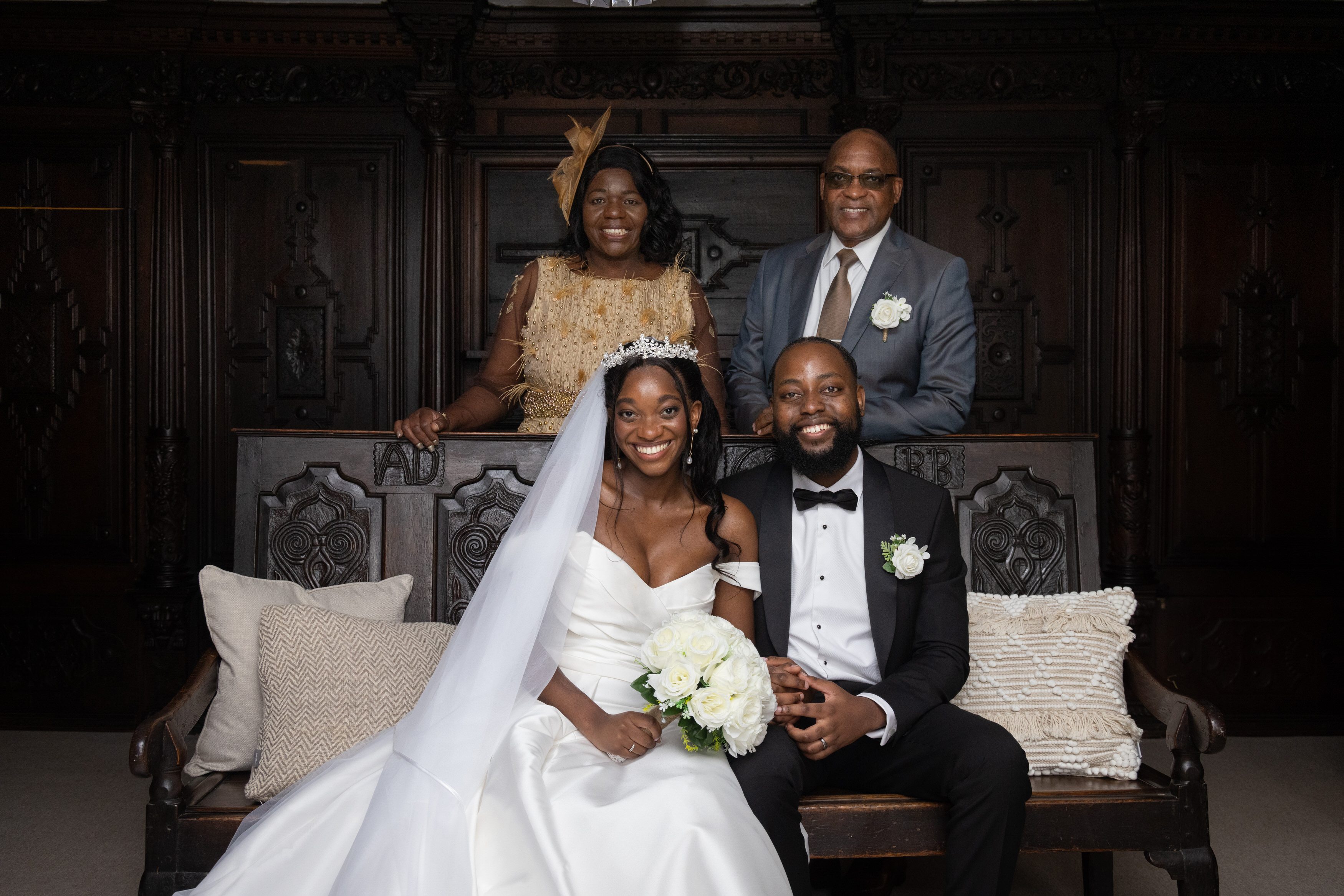 The bride and groom have photos with their family