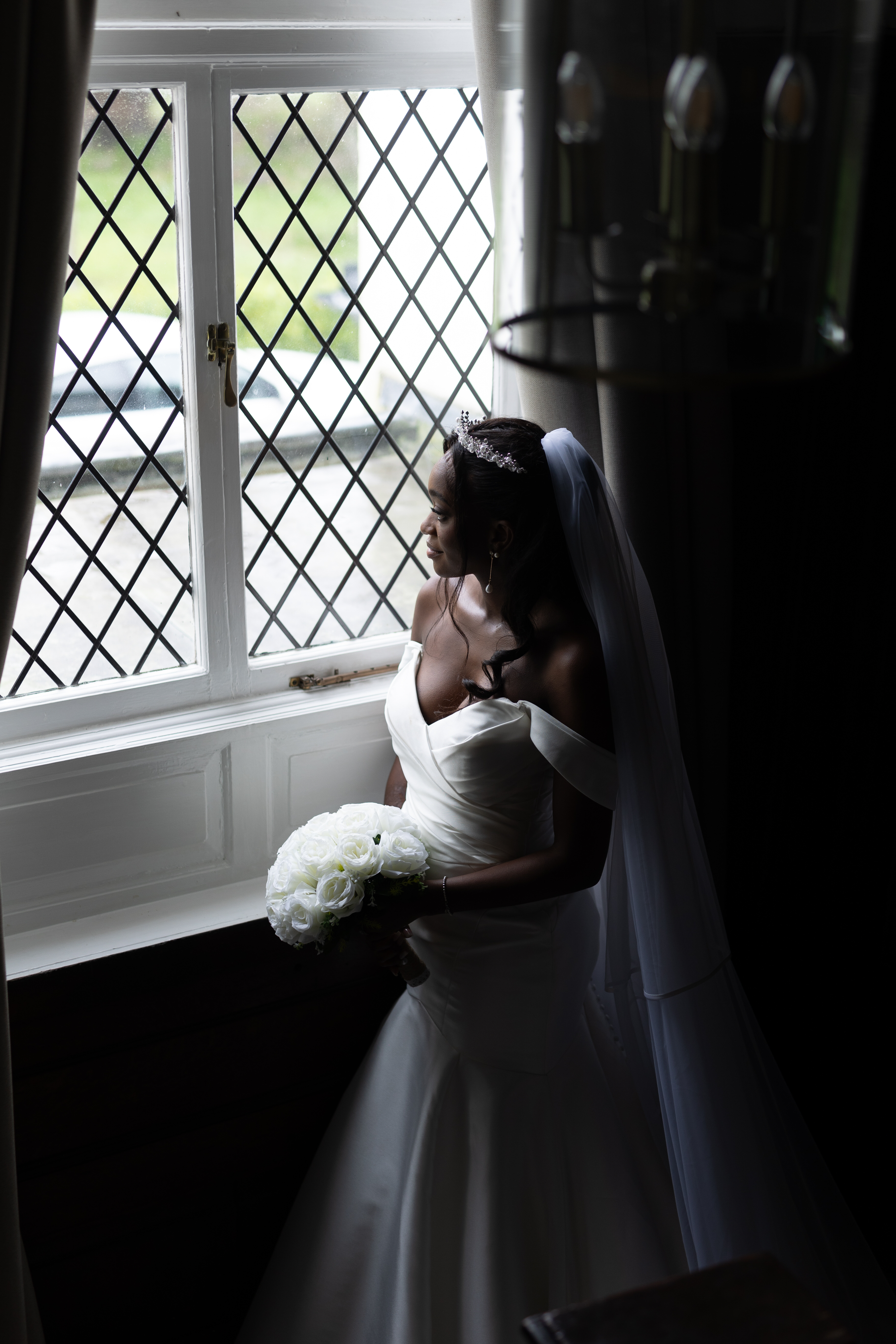 The Bride looking out of the window after her wedding ceremony 