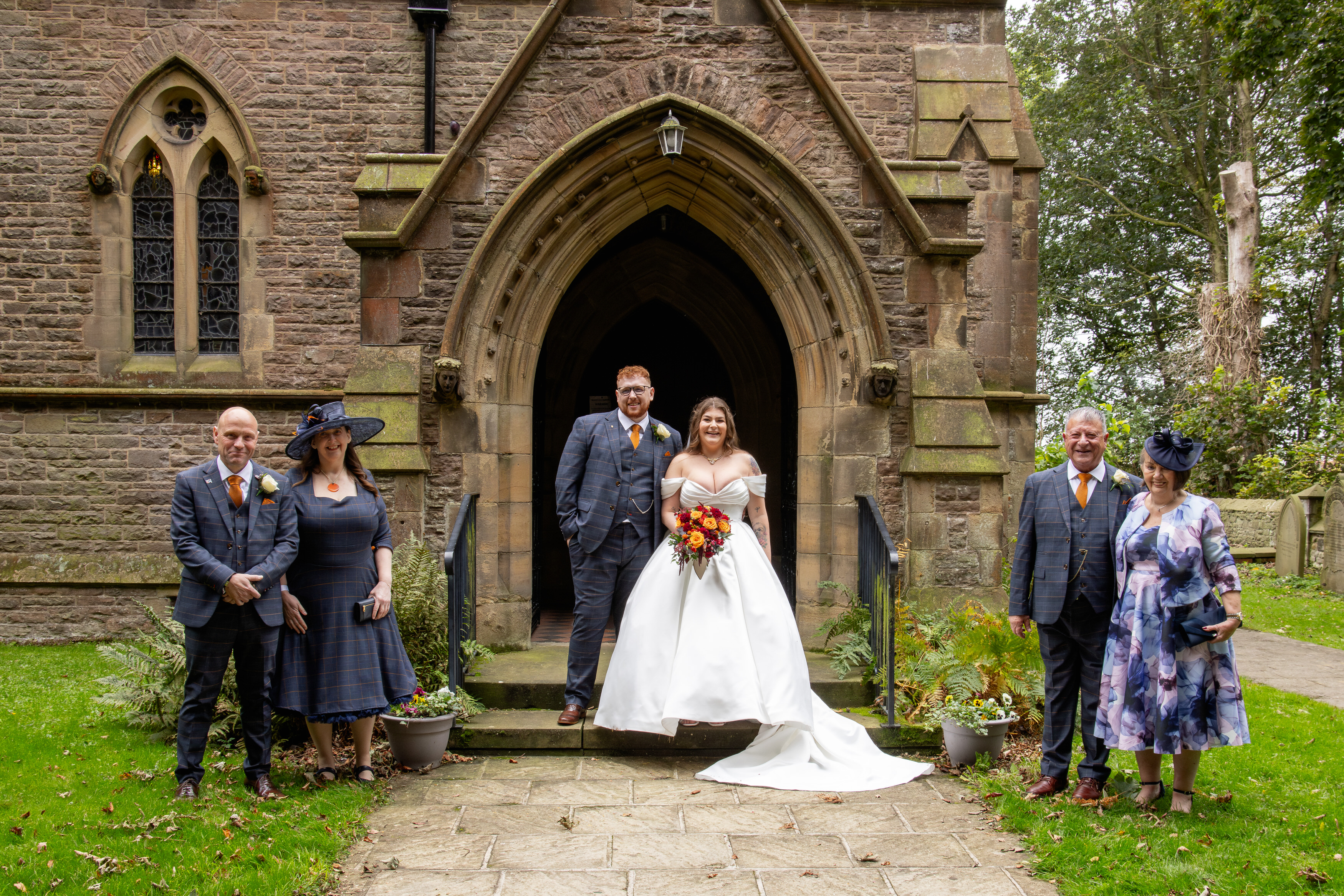 The bride and groom with their parents 