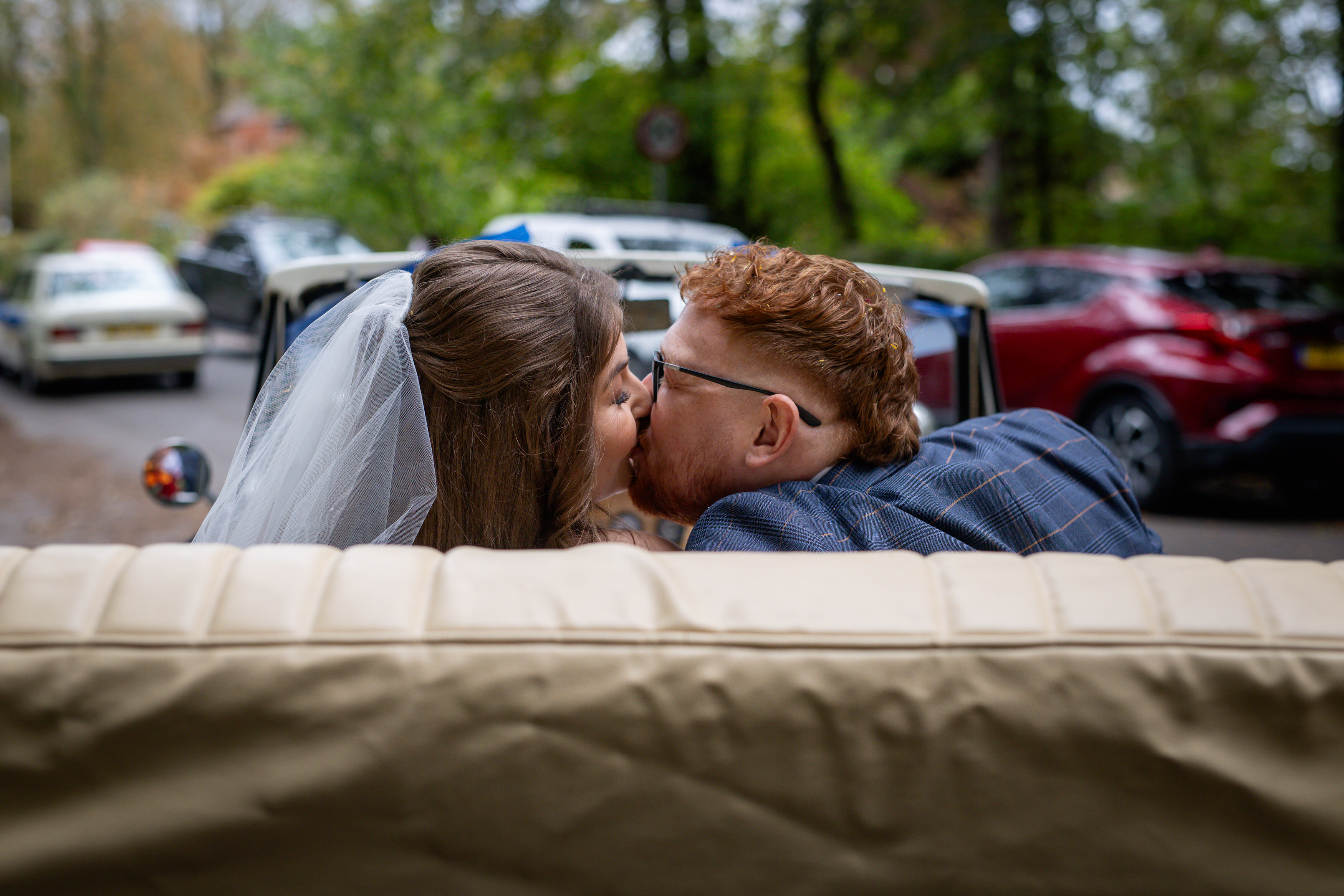 The couple get into the wedding car 