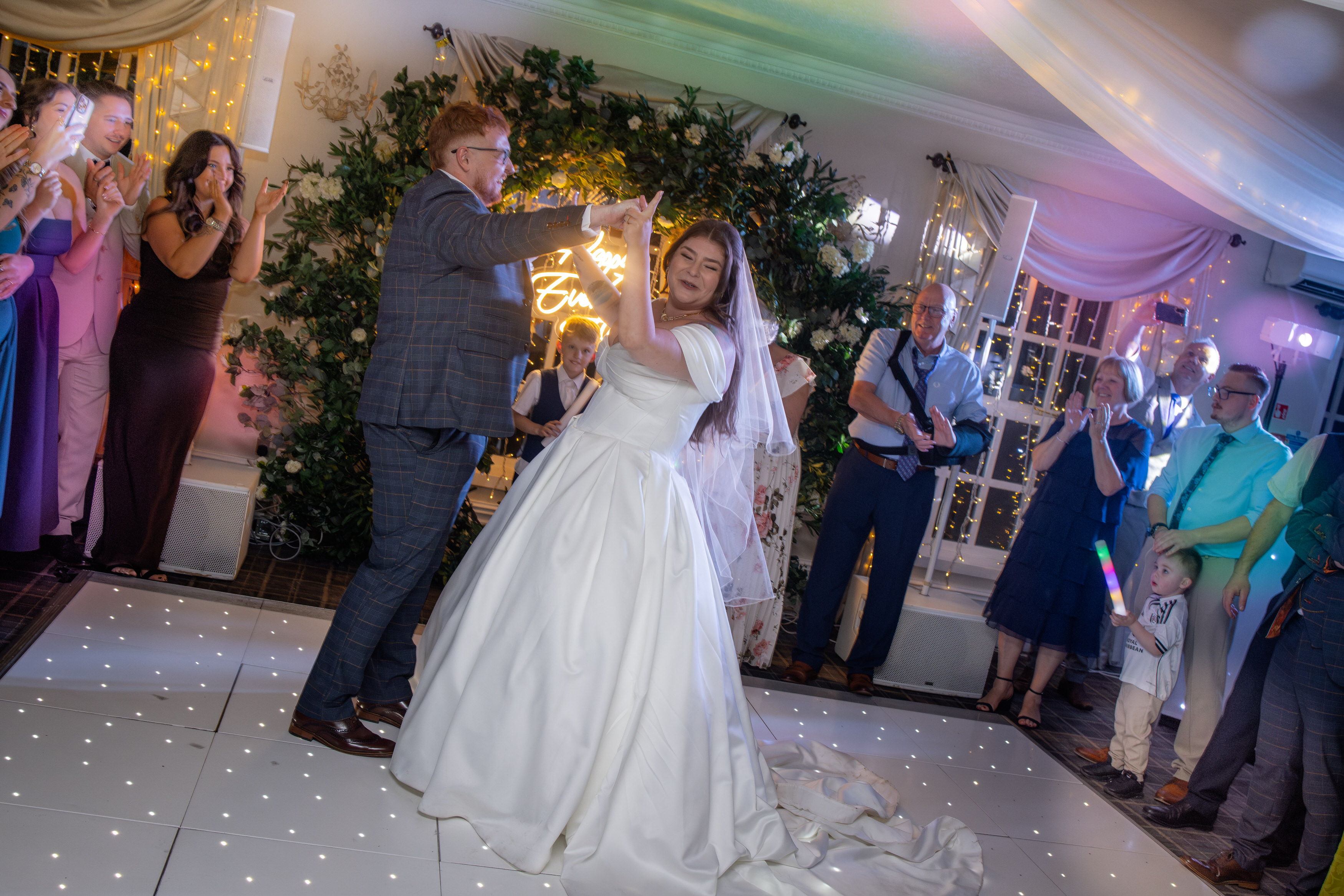 The bride and groom take to the dance floor for the first dance 