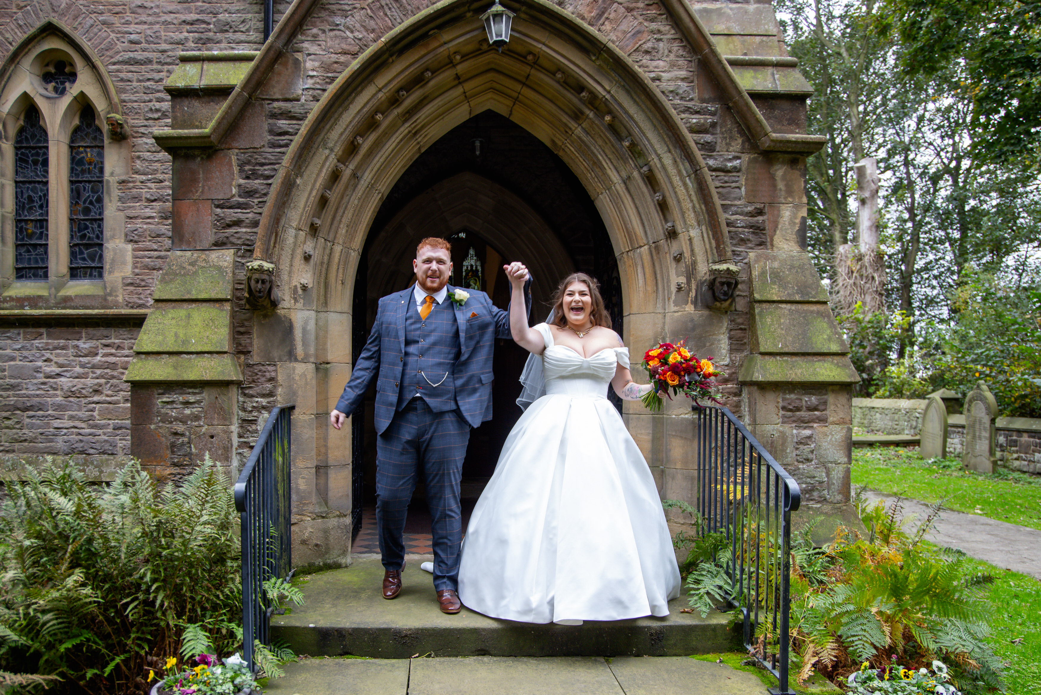 Leila and Samuel celebrate as they walk out of the church