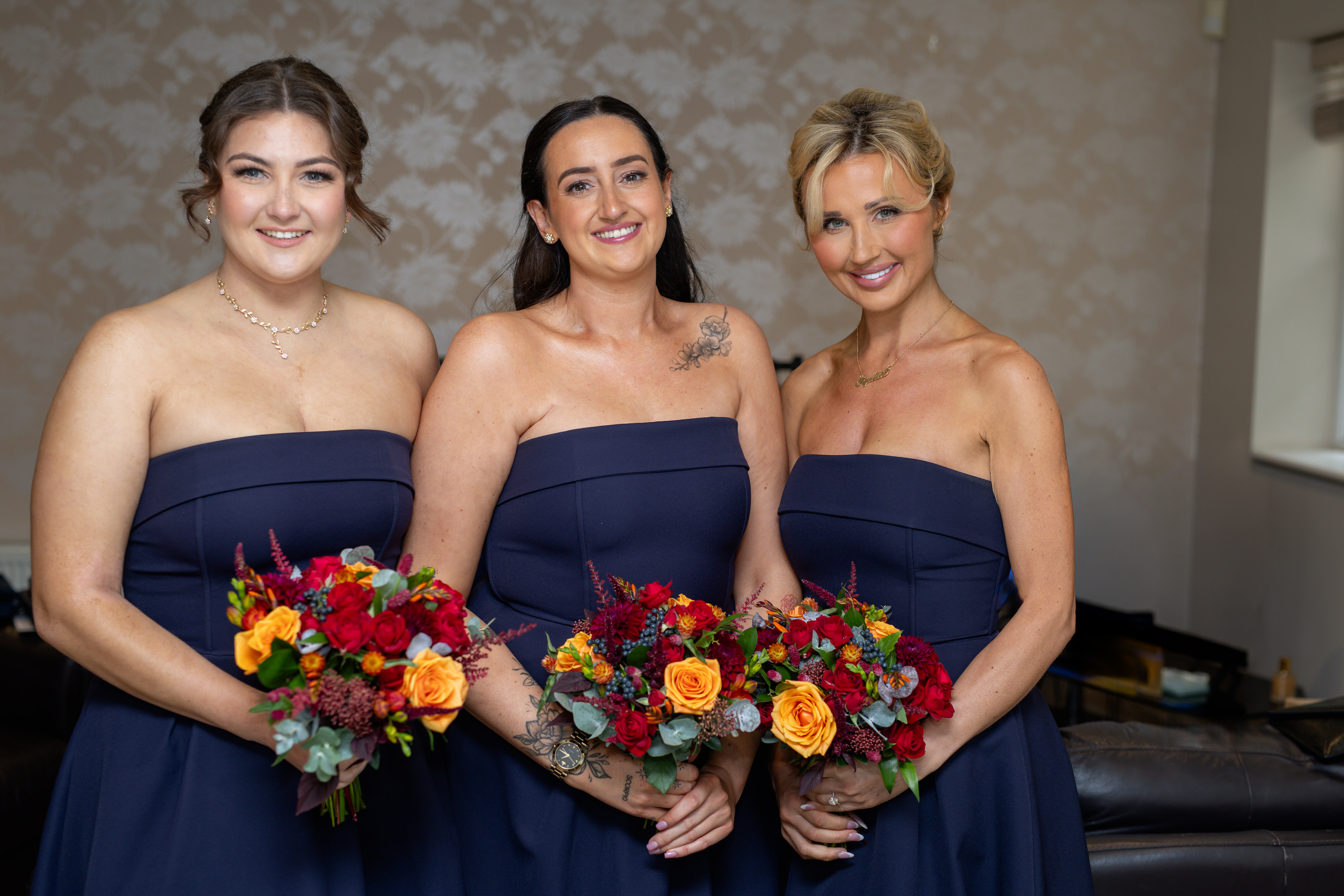 The bridesmaids are all ready with their bouquets 