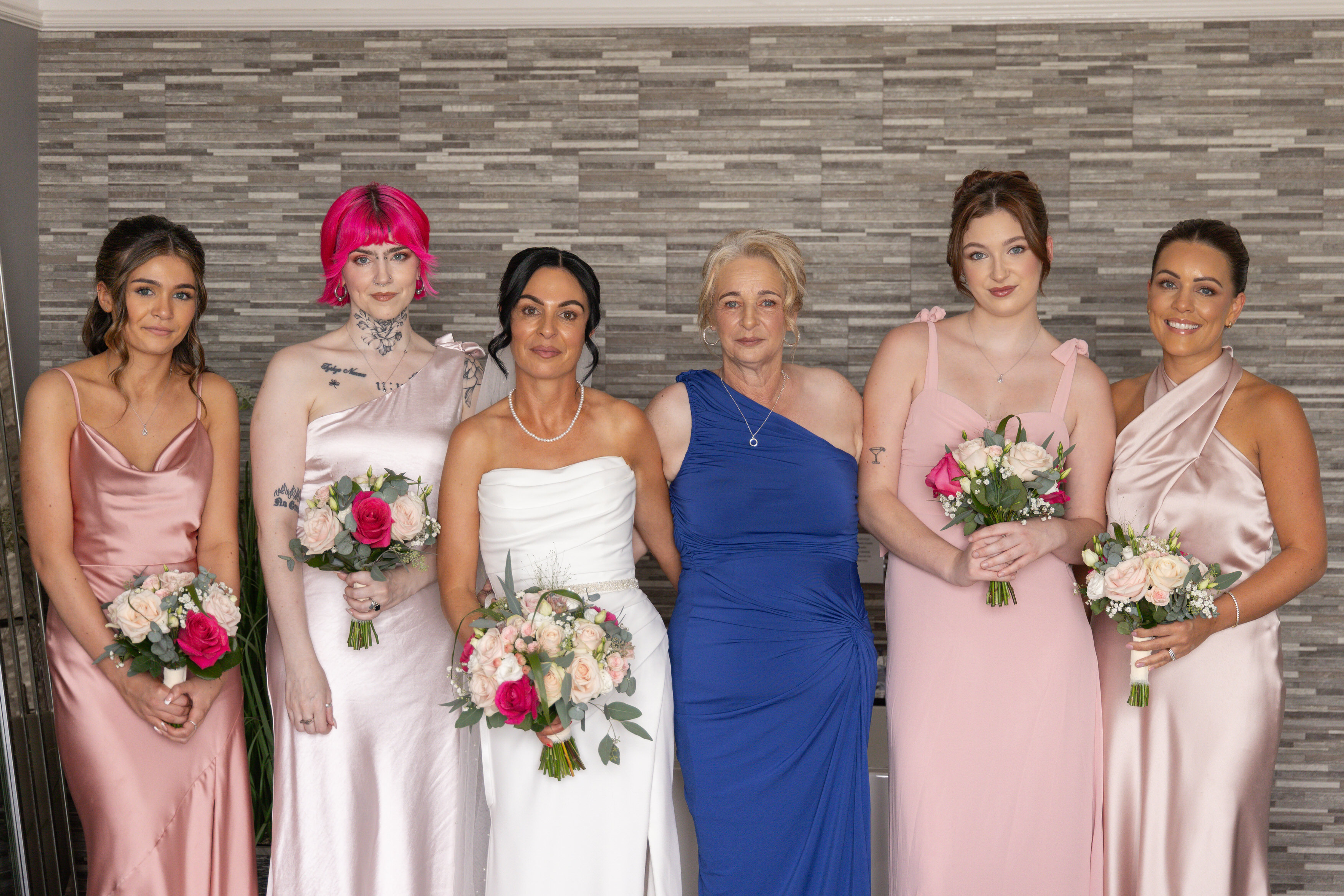 The bride and her bridesmaid and mother 