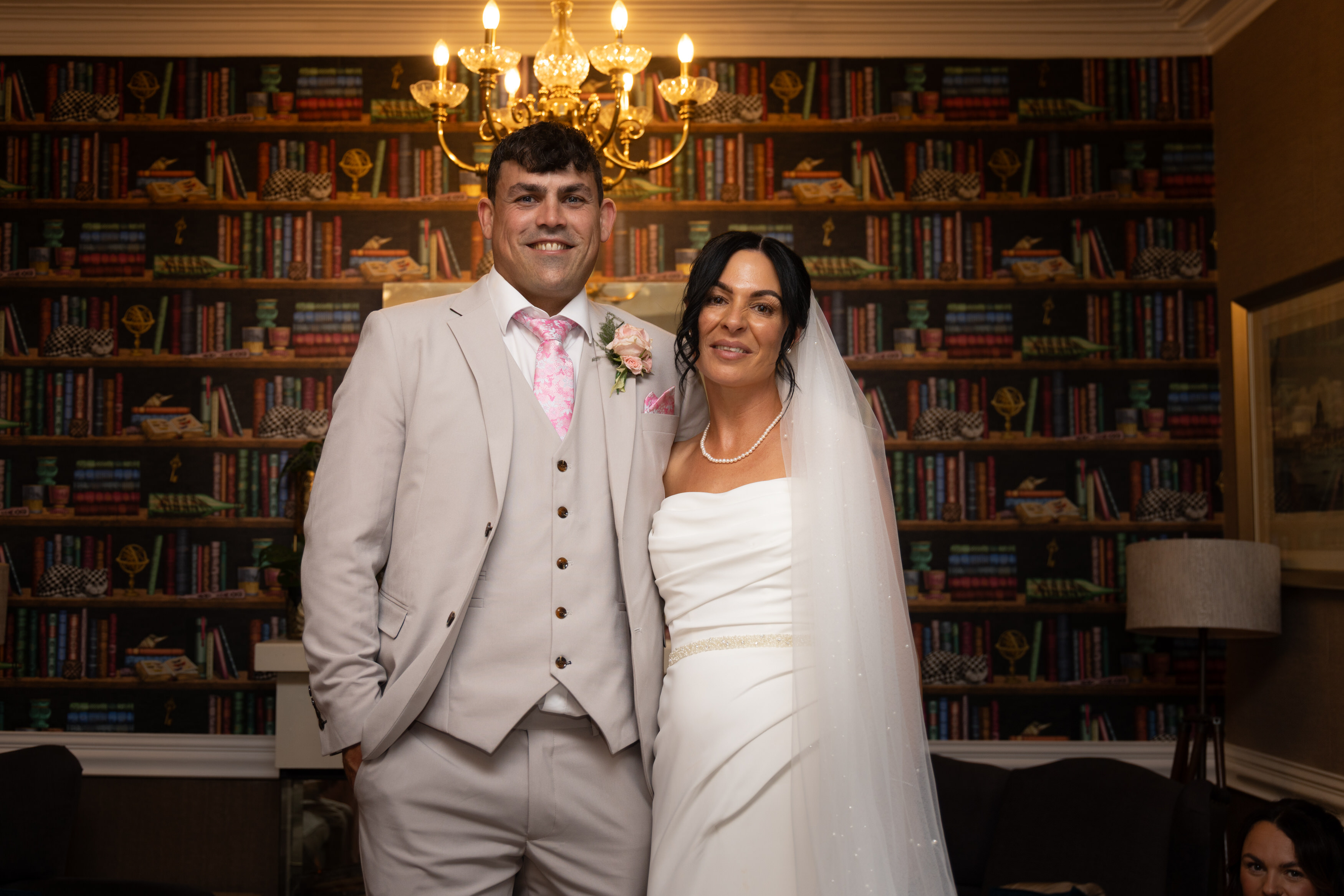 The bride and groom posed for a photo inside the glendower hotel 