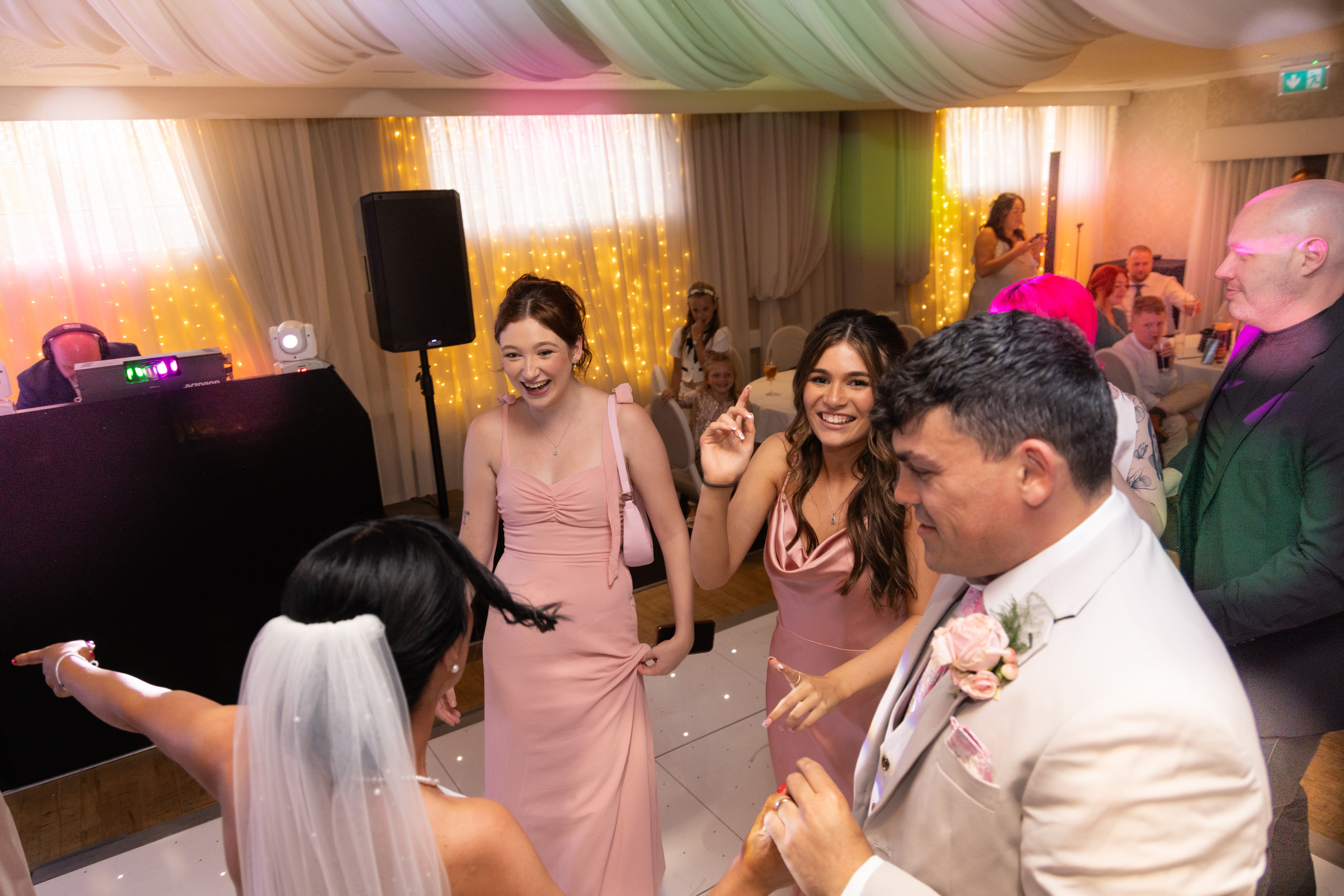 The wedding guests join the bride and groom on the dance floor 