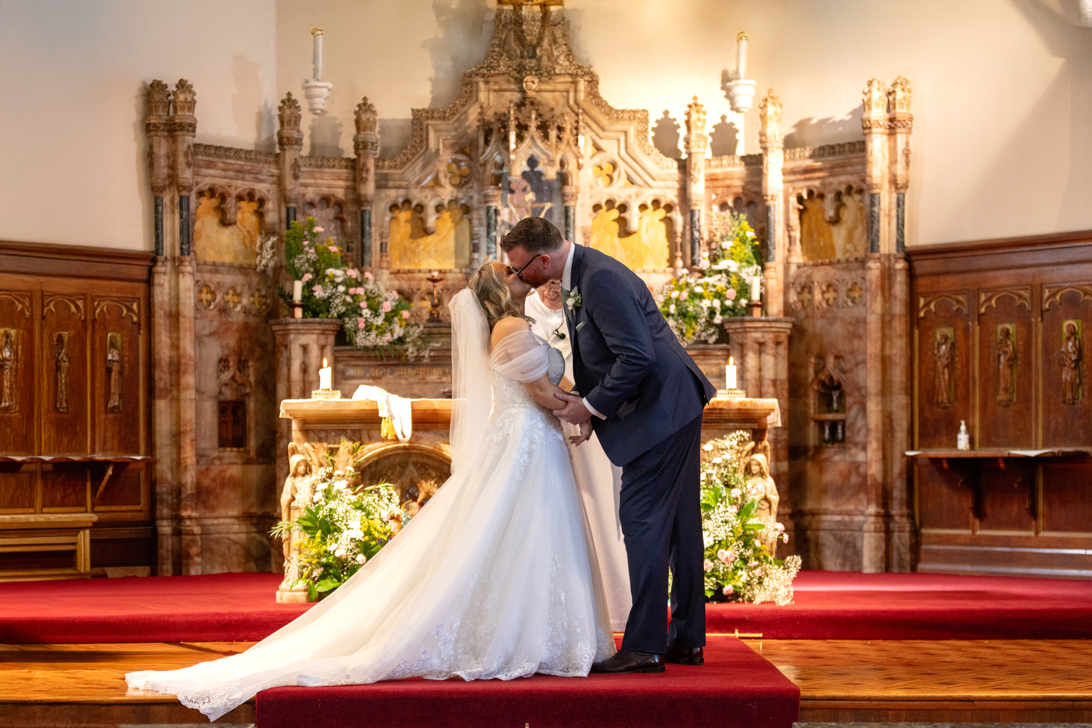 The couple seal their wedding with a kiss