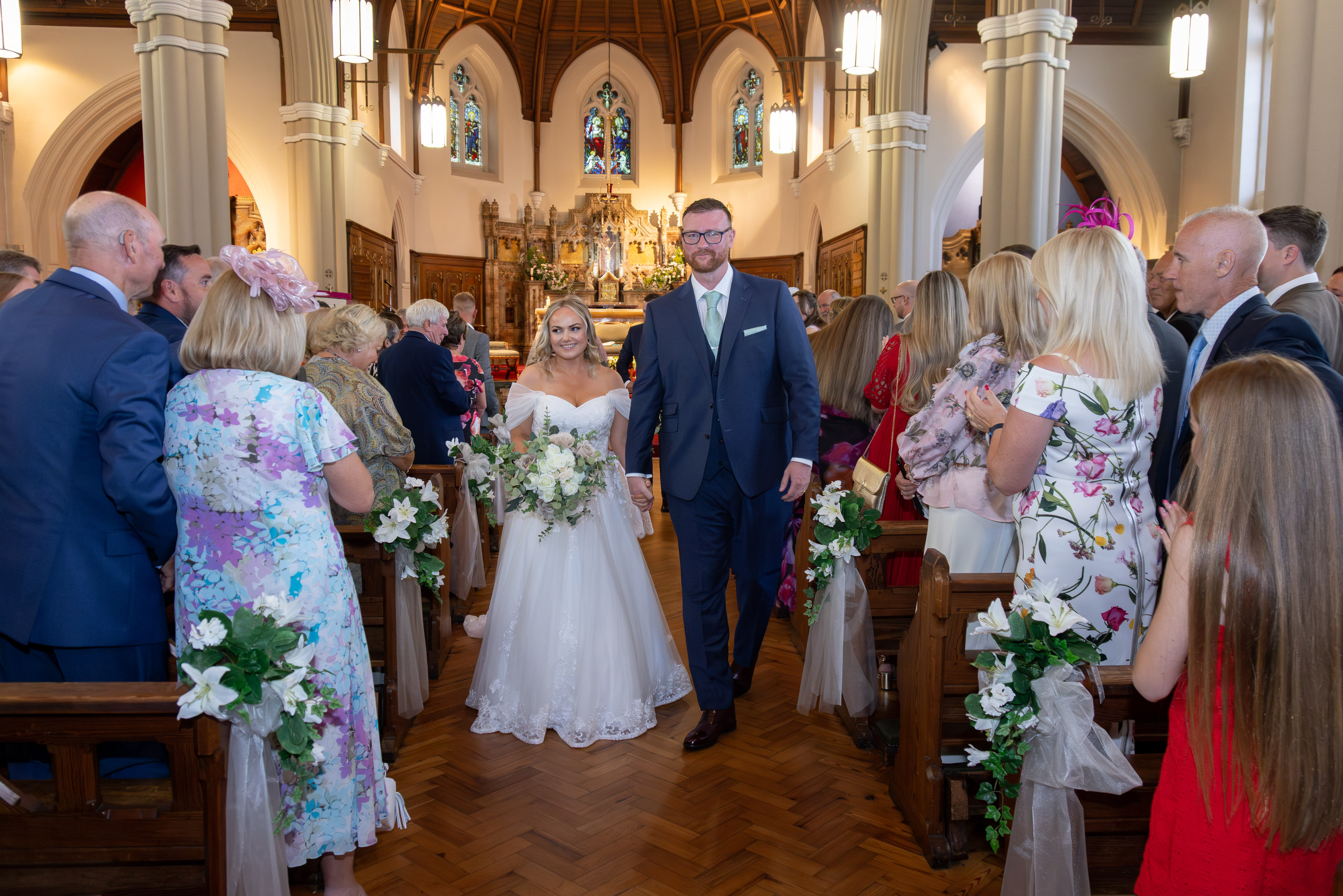Jeanette and Shaun make their way out of the church 