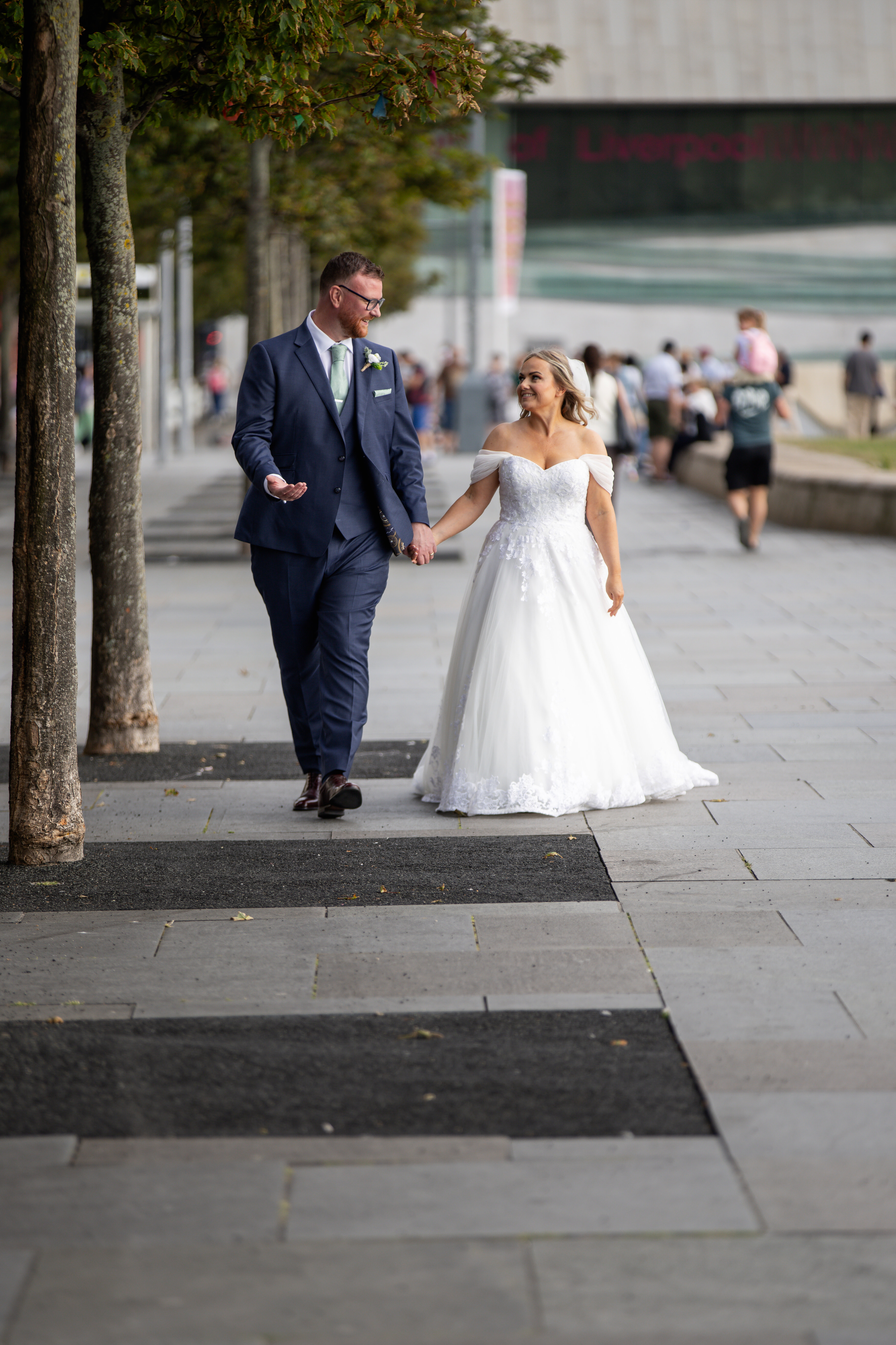 The Bride in groom go for a walk along Liverpool docks 