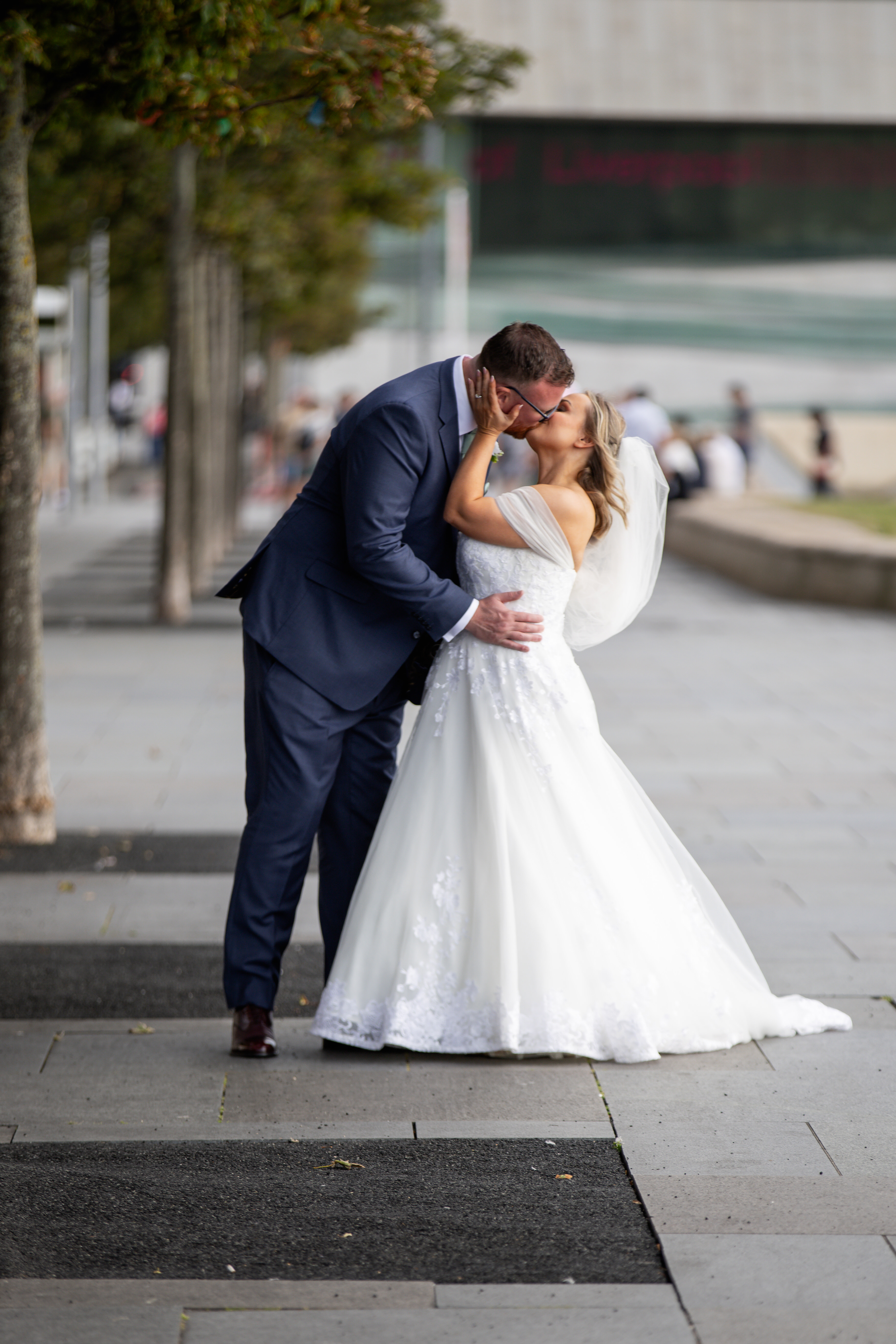 The Bride in groom go for a walk along Liverpool docks 