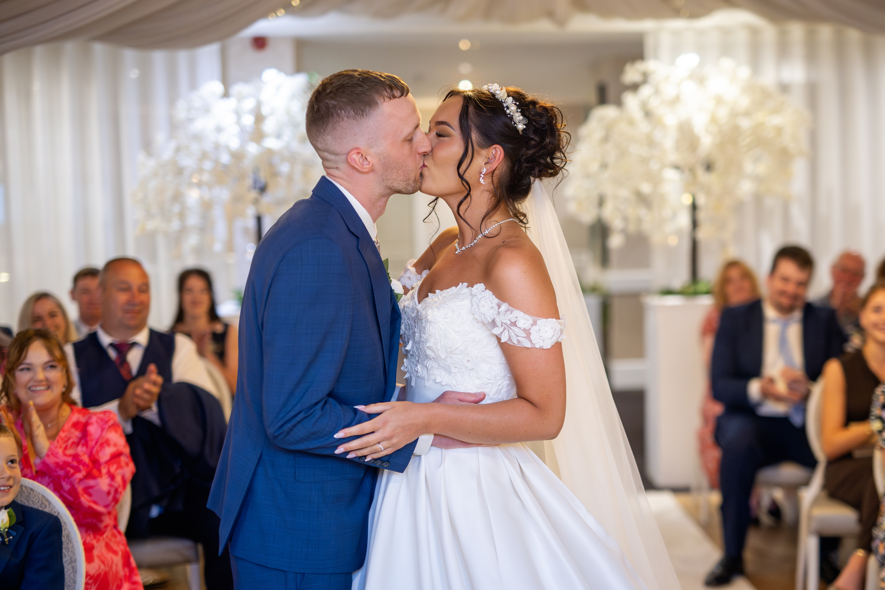 The happy couple seal their wedding with a kiss 