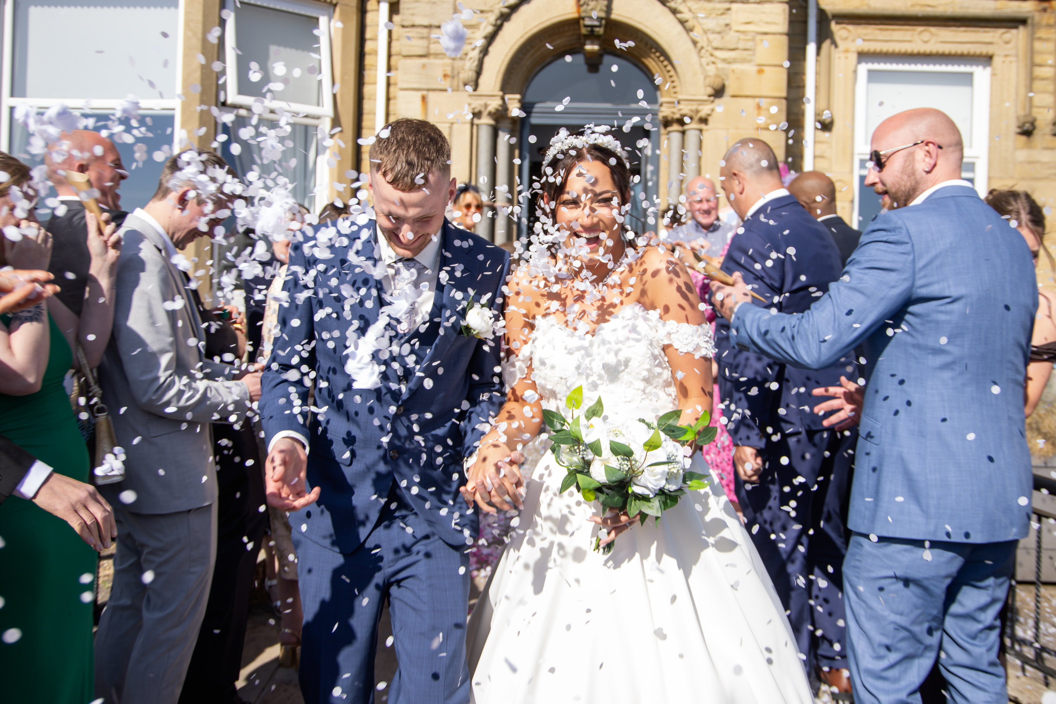The couple gets showered in confetti 