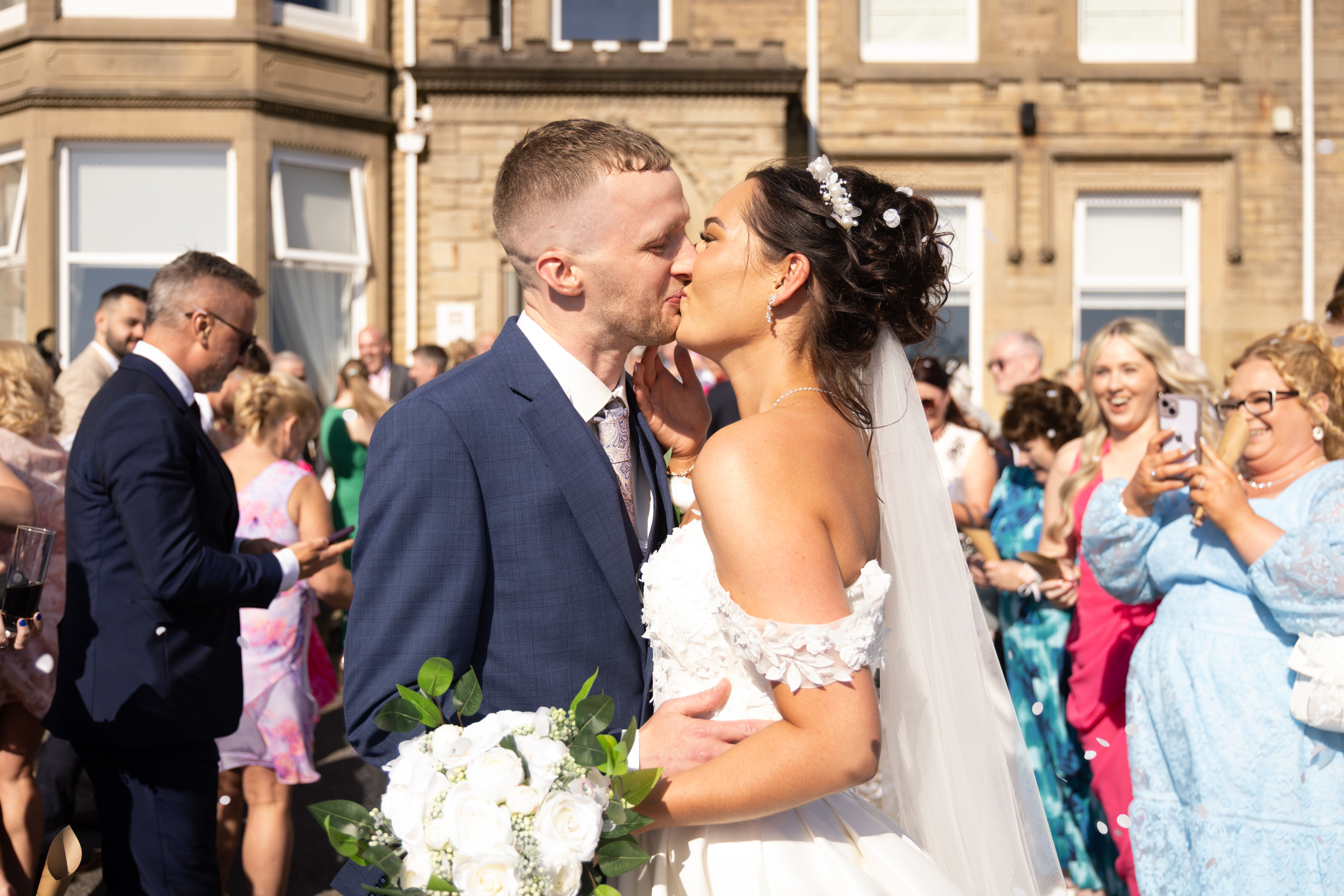 The happy couple seal their wedding with a kiss 