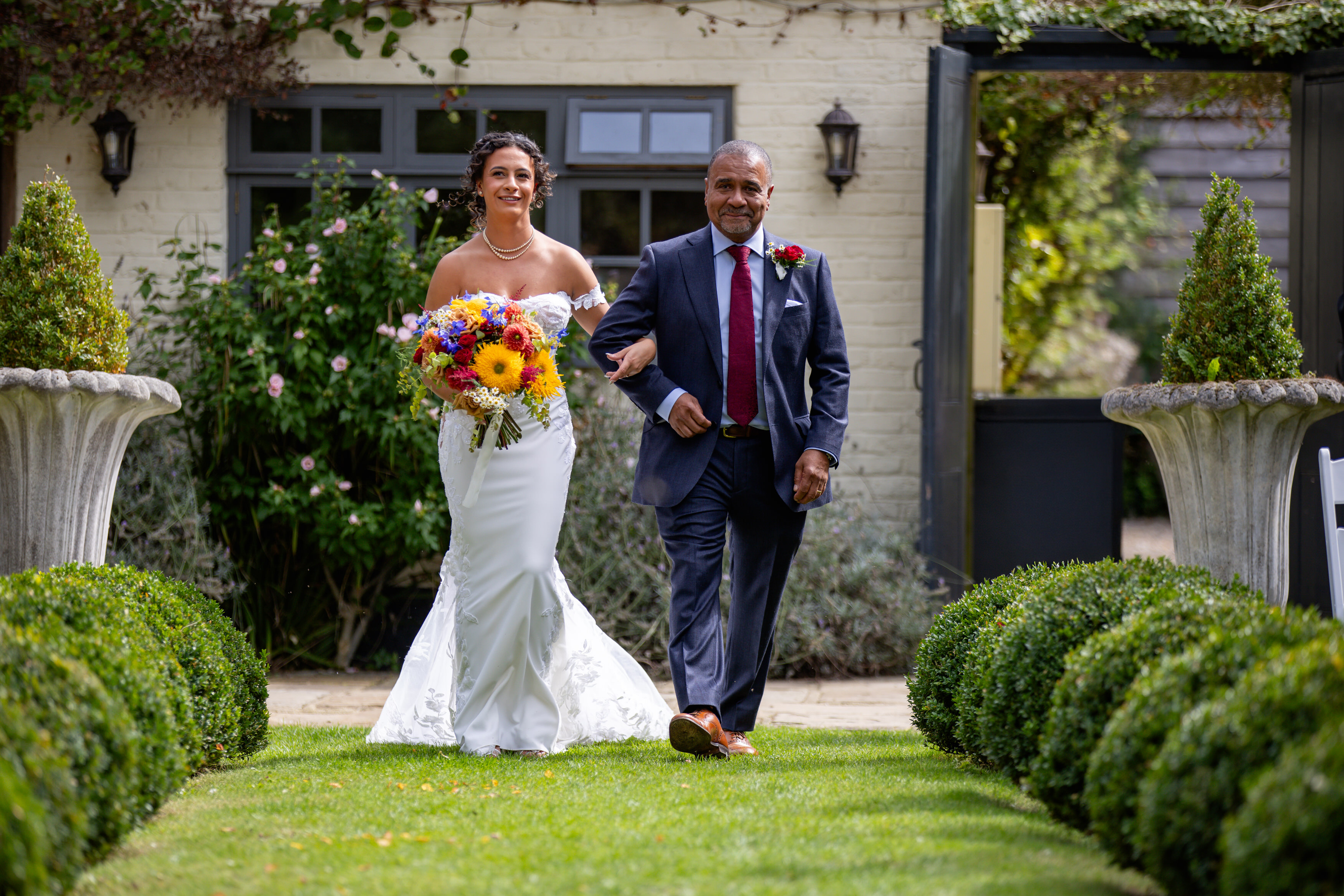 The Bride walking down the aisle with her father 