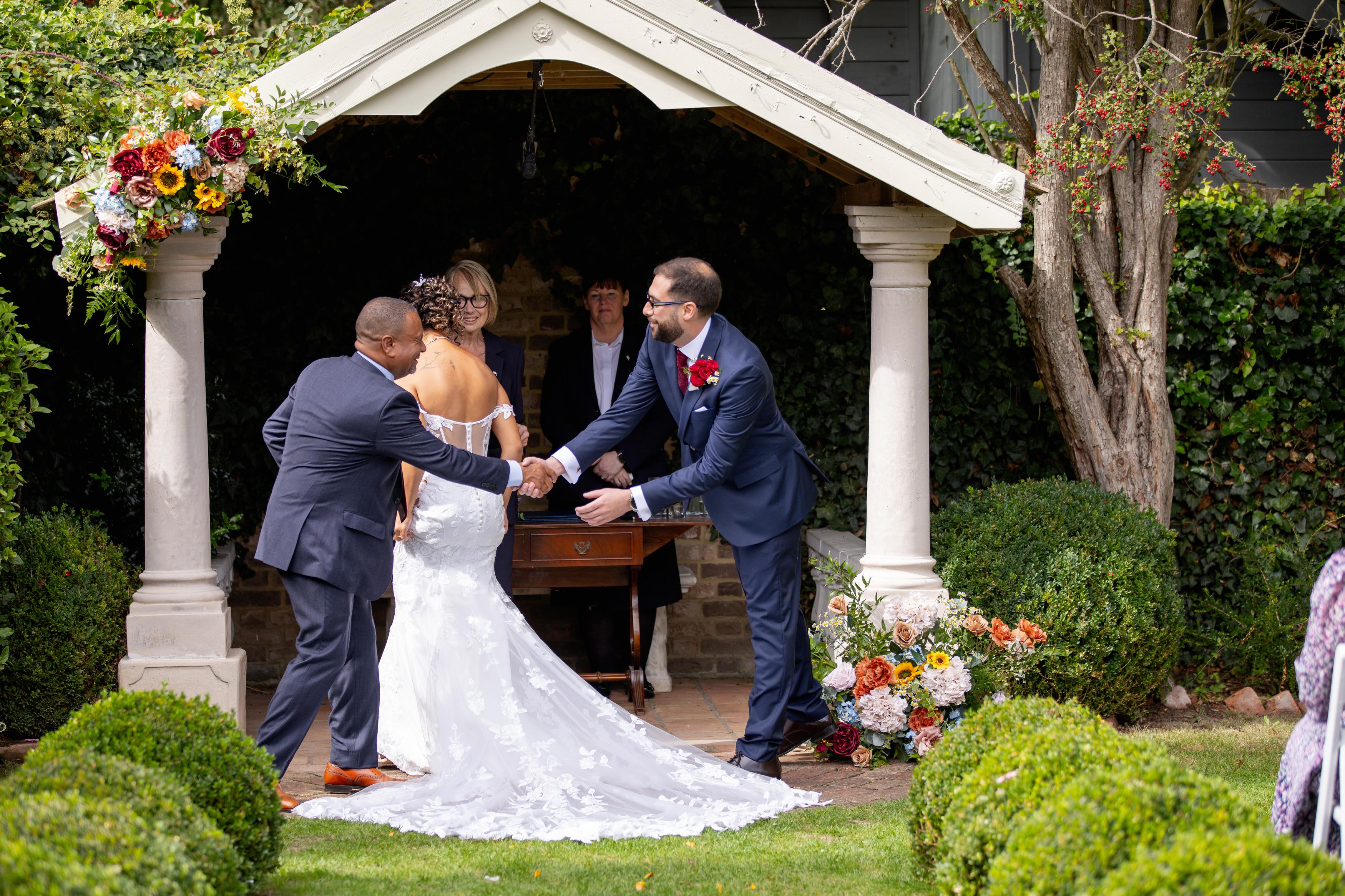 The father of the bride Shakes the groom's hand 