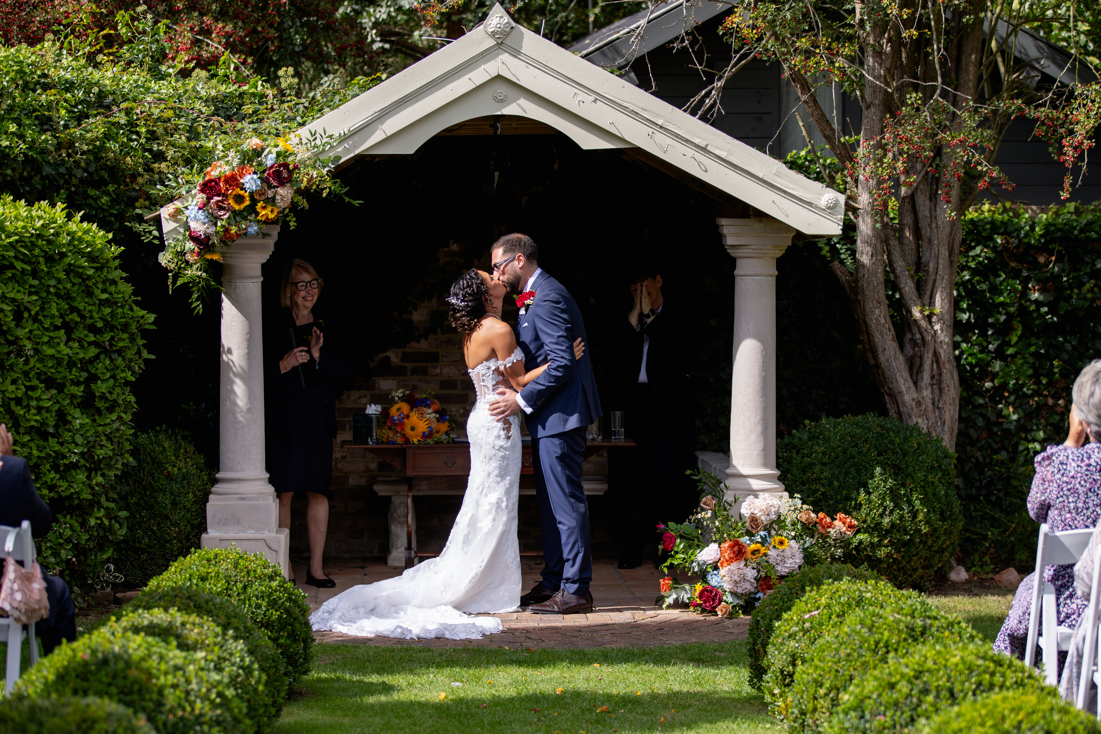 The bride and groom have a wedding kiss 