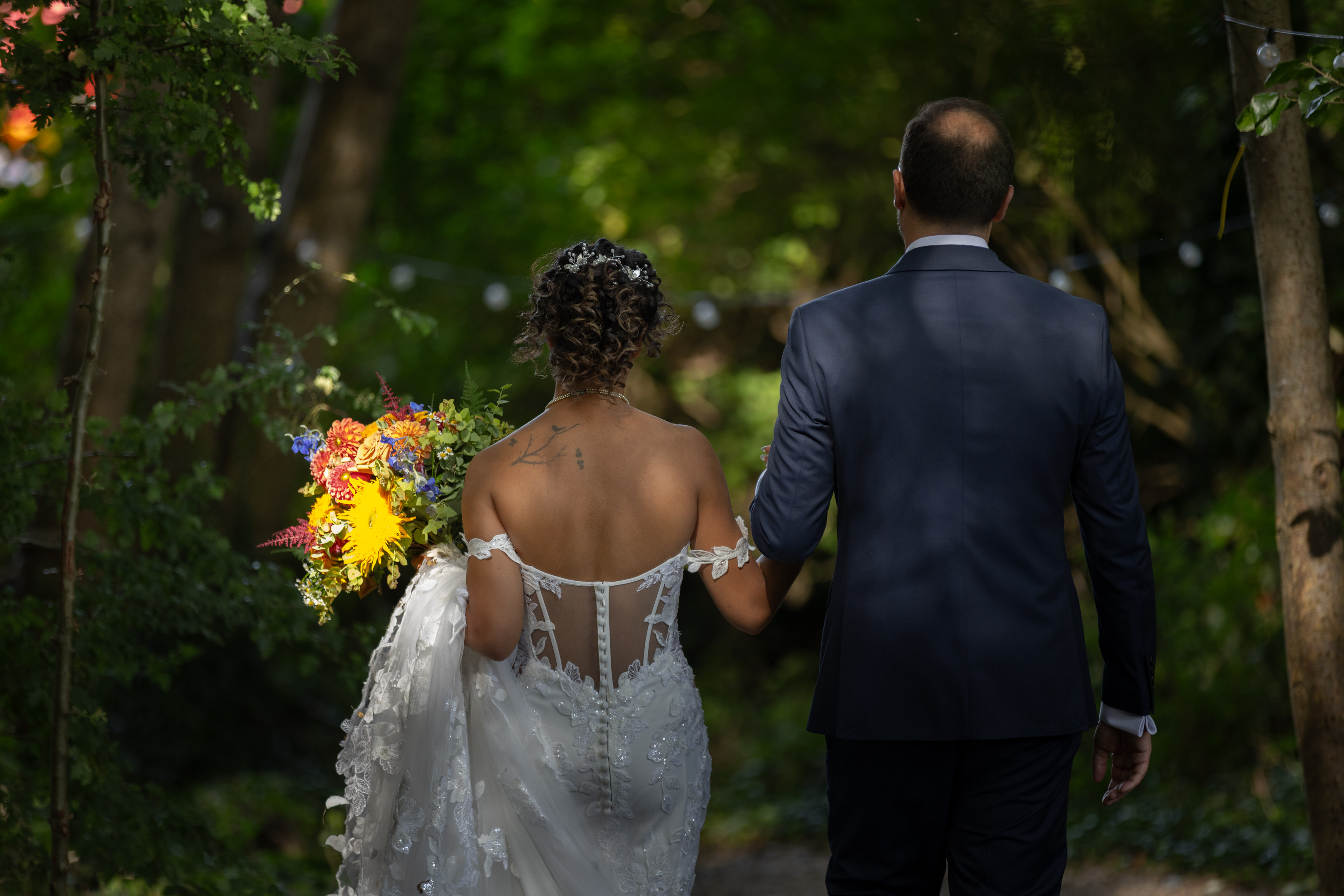 The Bride and Groom walked through the woods to the fun fair