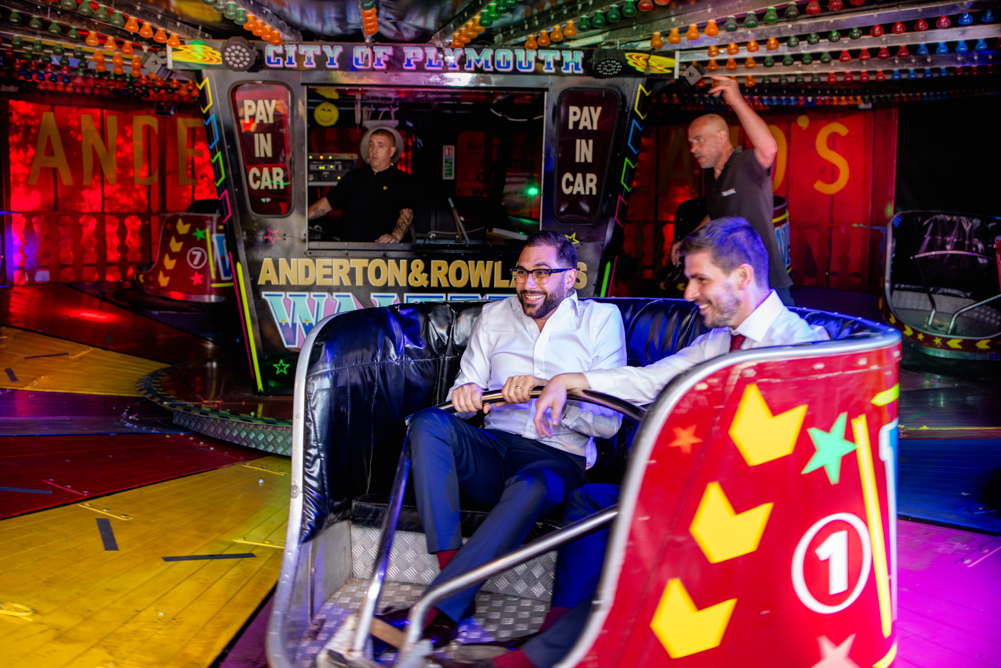 The groom having fun on the rides 