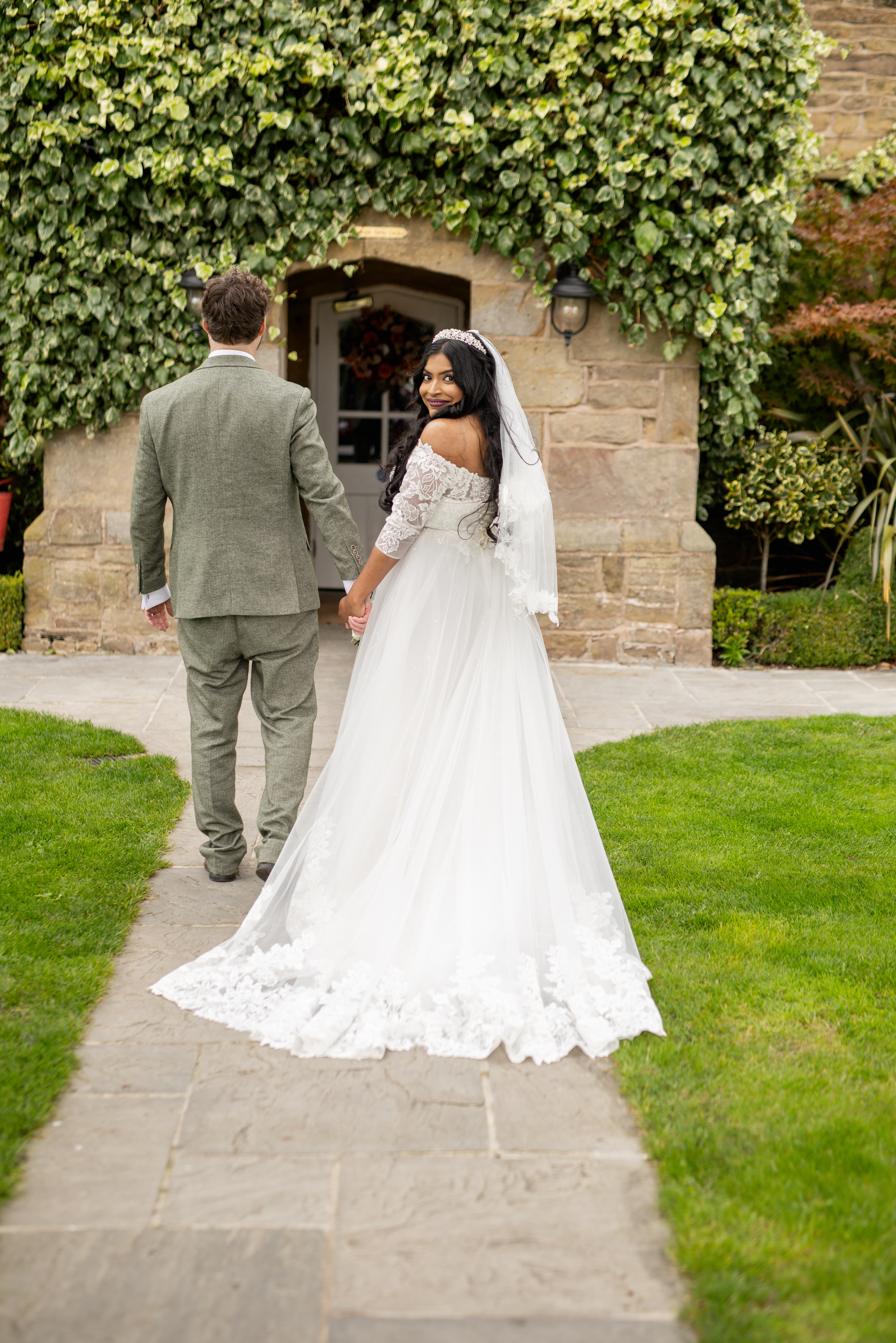 Udara and Tony make their way into Haighton Manor for the wedding reception