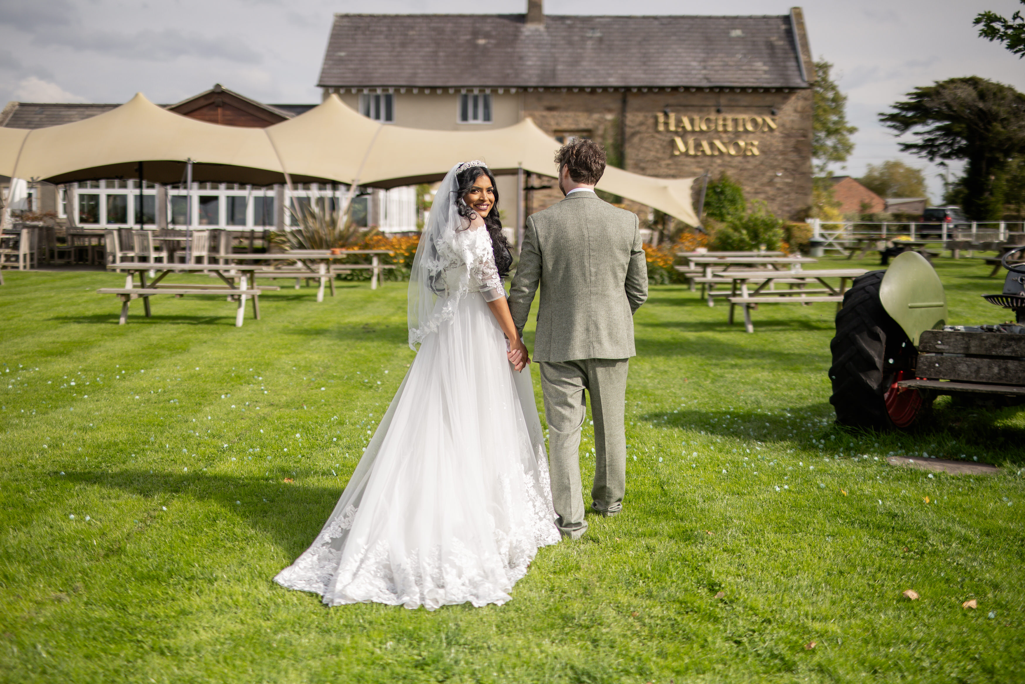 The bride and groom go for a walk at Haighton Manor 