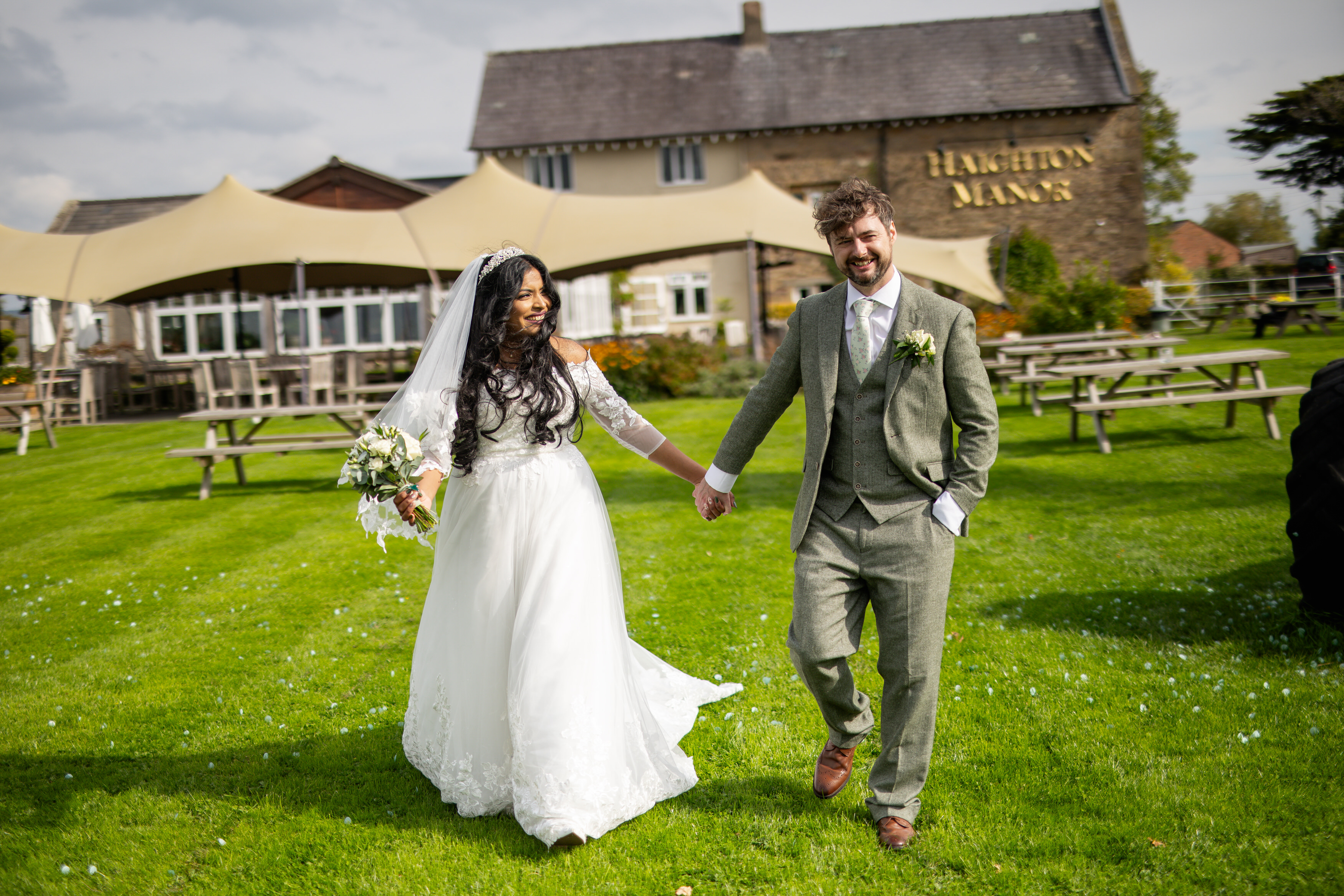The bride and groom go for a walk at Haighton Manor 