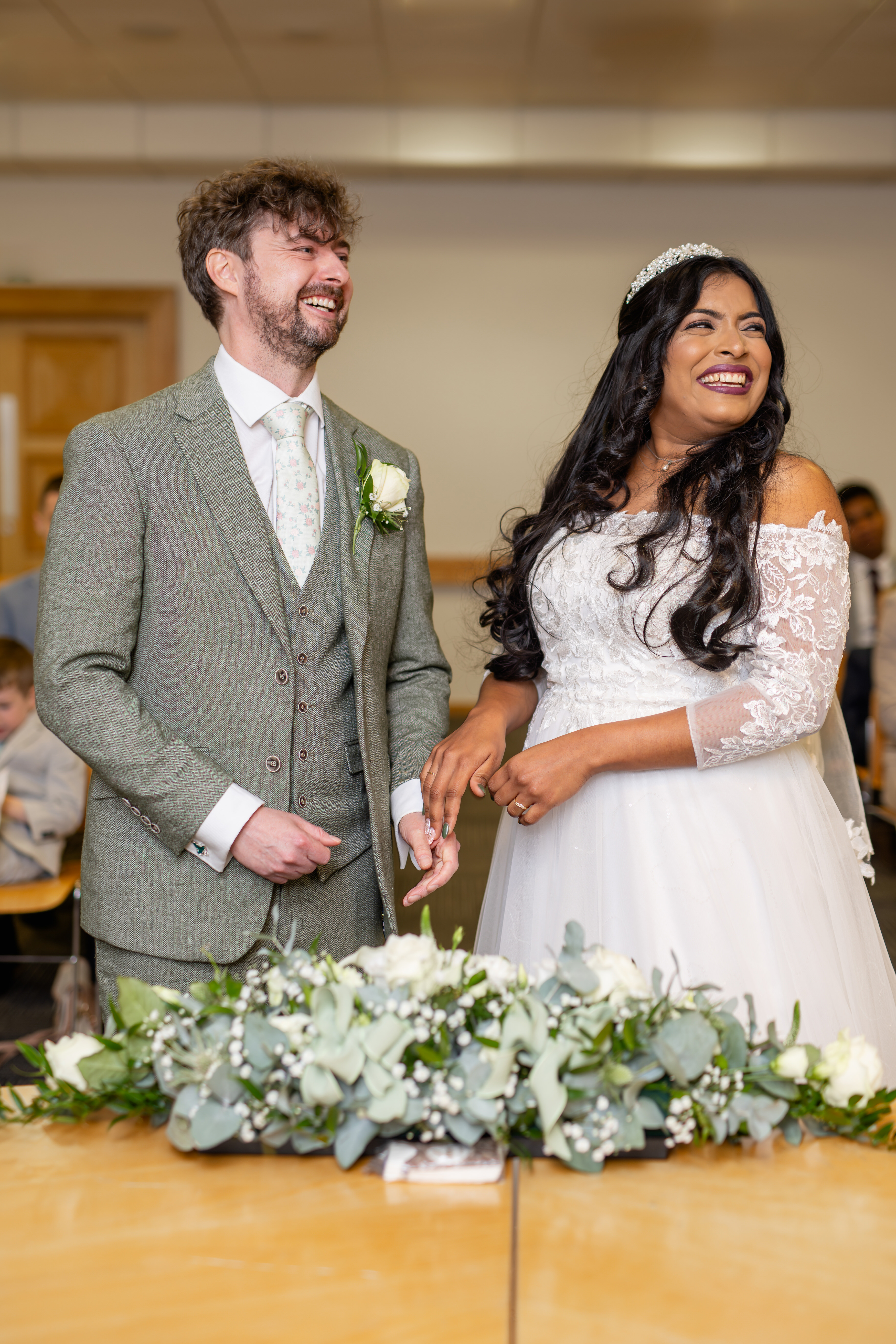 The bride and groom laughing during the wedding ceremony 