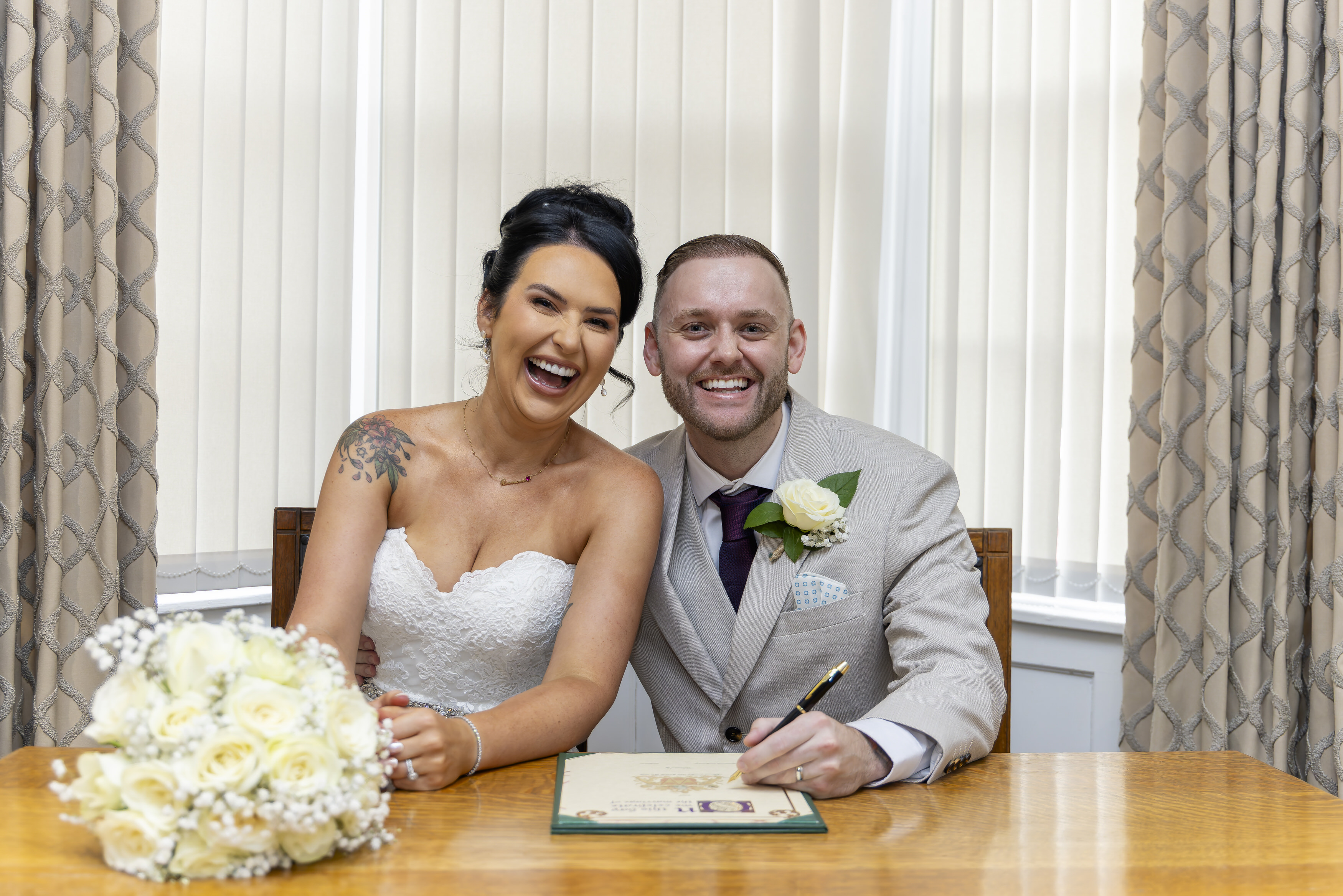 The happy couple signed the wedding register 